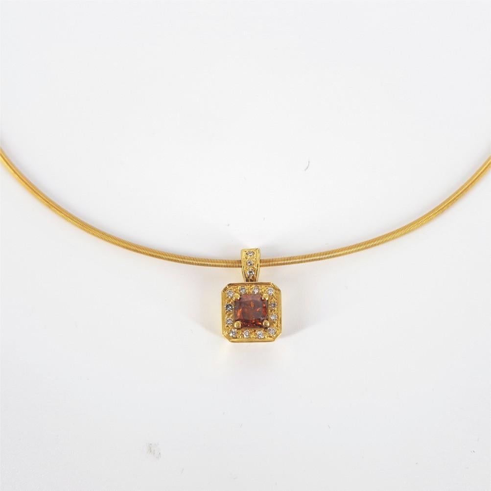 This stunning necklace is 40.6cm in length and weighs 10.9grams. This Necklace is set in 18ct Yellow Gold and is studded with 1 Radiant Cut Cognac weighing an estimated 1.01ct, and 15 Round Brilliant Cut Diamonds (GH vs-si) weighing 0.11carat in