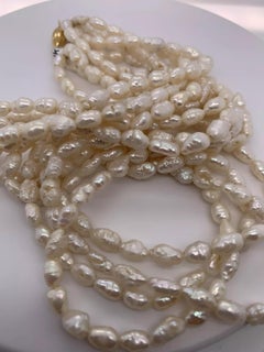18ct Yellow gold cultured rice pearl bids necklace.
