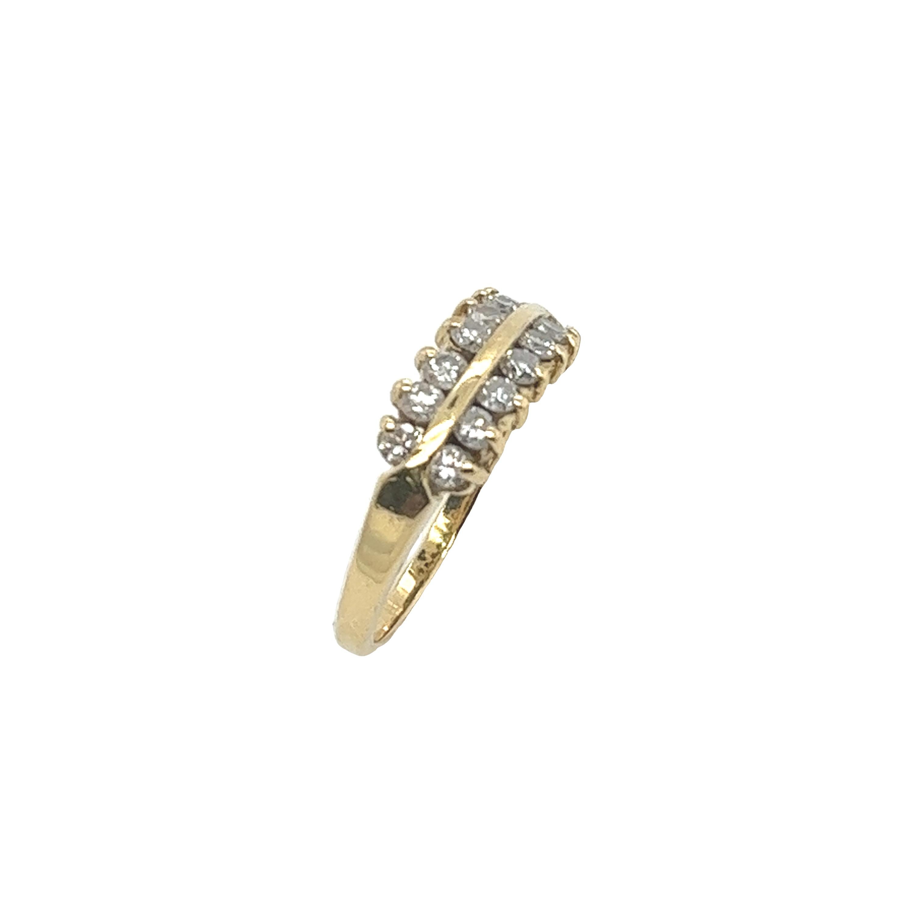 An elegant diamond 2-row ring, 
set with 14 round brilliant cut natural diamonds, 
0.42ct total diamond weight.
in an 18ct yellow gold setting.
Total Diamond Weight: 0.42ct
Diamond Colour: H
Diamond Clarity: SI1
Width of Band: 1.61mm
Length of Head:
