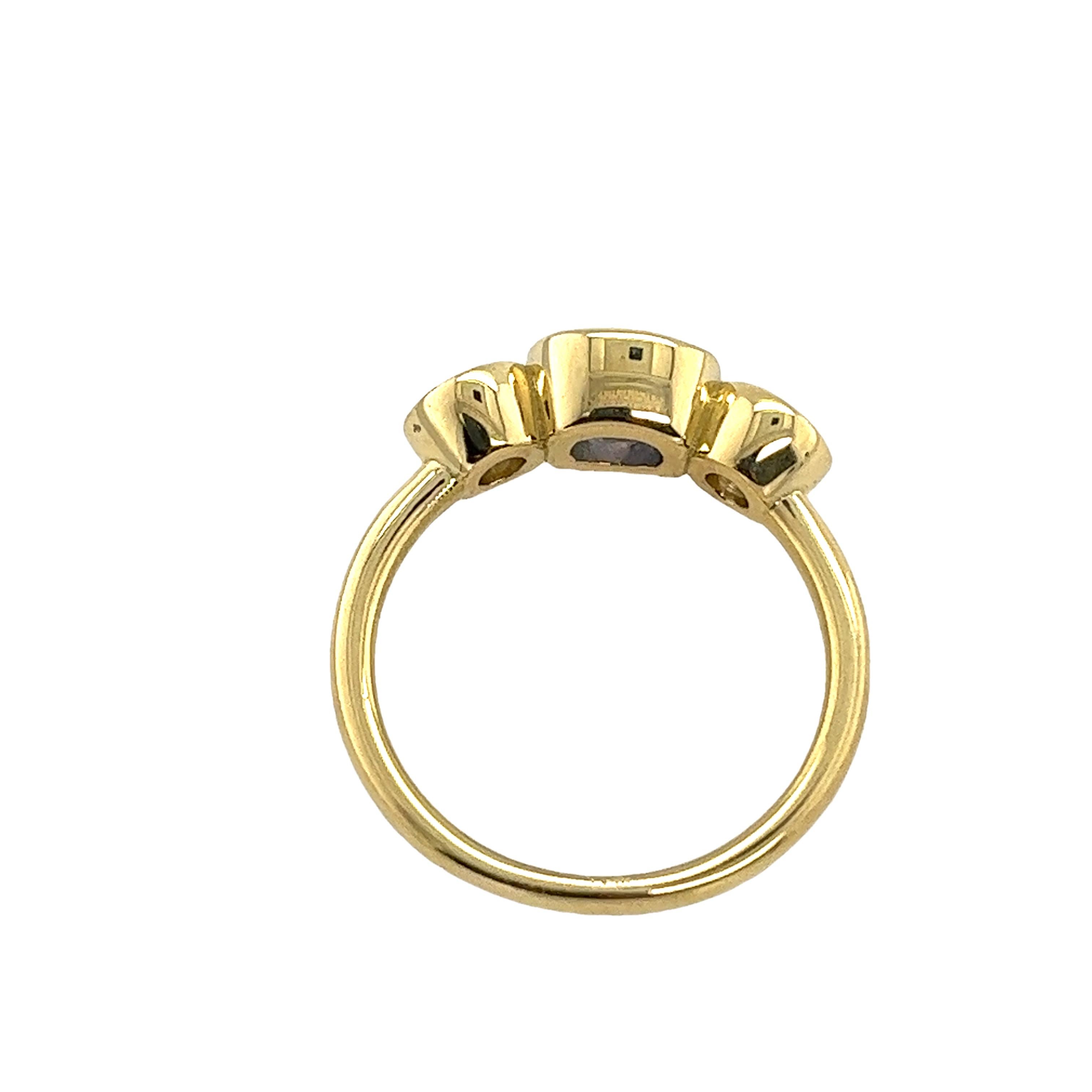 This gorgeous diamond 3-stone ring 
set in an 18ct yellow gold setting, 
with 2 natural round brilliant cut diamonds and cushion shape sapphire.
This is a unique and eye-catching ring.
Total Diamond Weight: 0.70ct
Diamond Colour: H
Diamond Clarity: