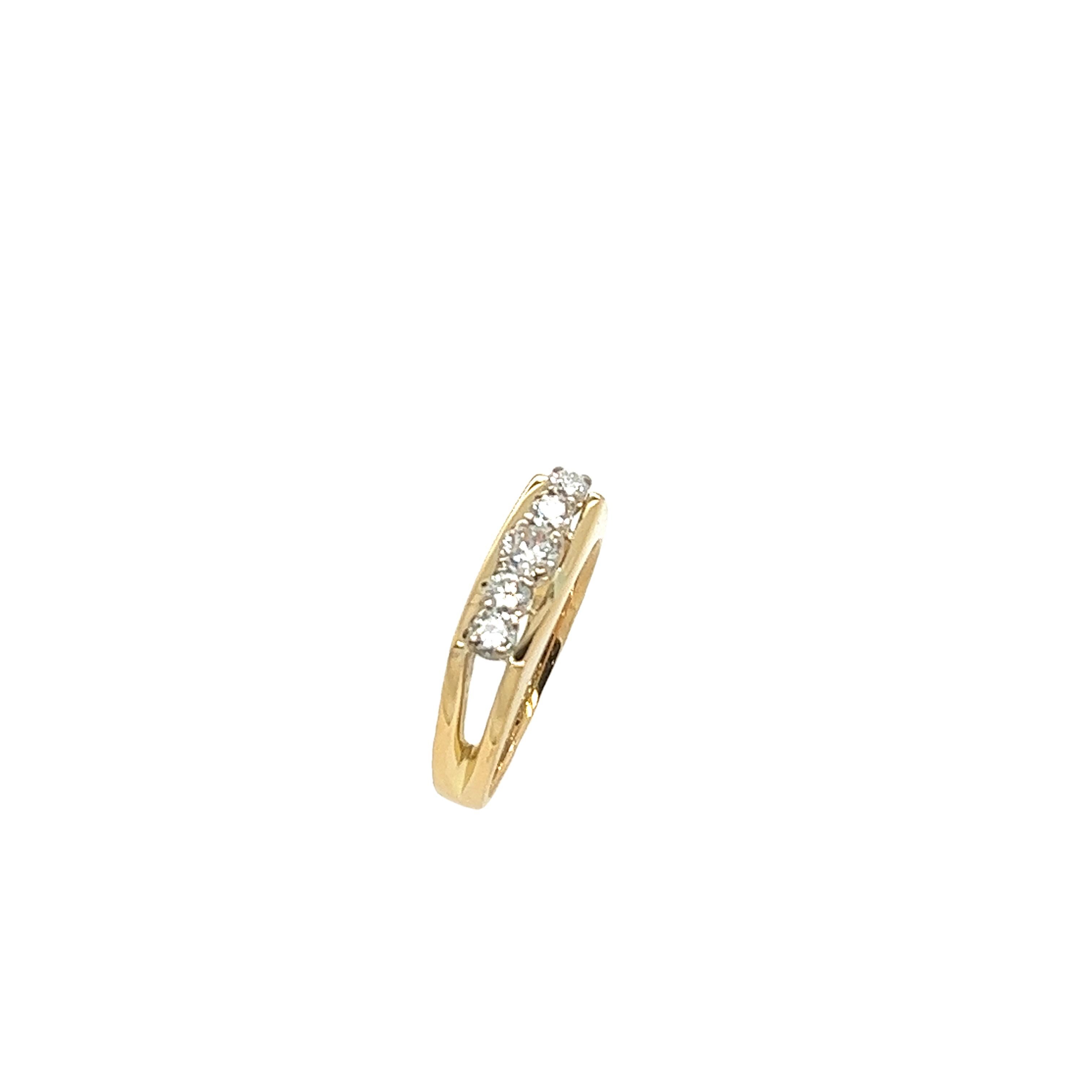 An elegant 5-stone diamond ring, 
set with 5 round old cut diamonds, 
in an 18ct yellow gold setting.
Total Diamond Weight: 0.35ct
Diamond Colour: G
Diamond Clarity: VSI
Width of Band: 2.35mm
Width of Head: 5.21mm
Length of Head: 13.68mm
Total
