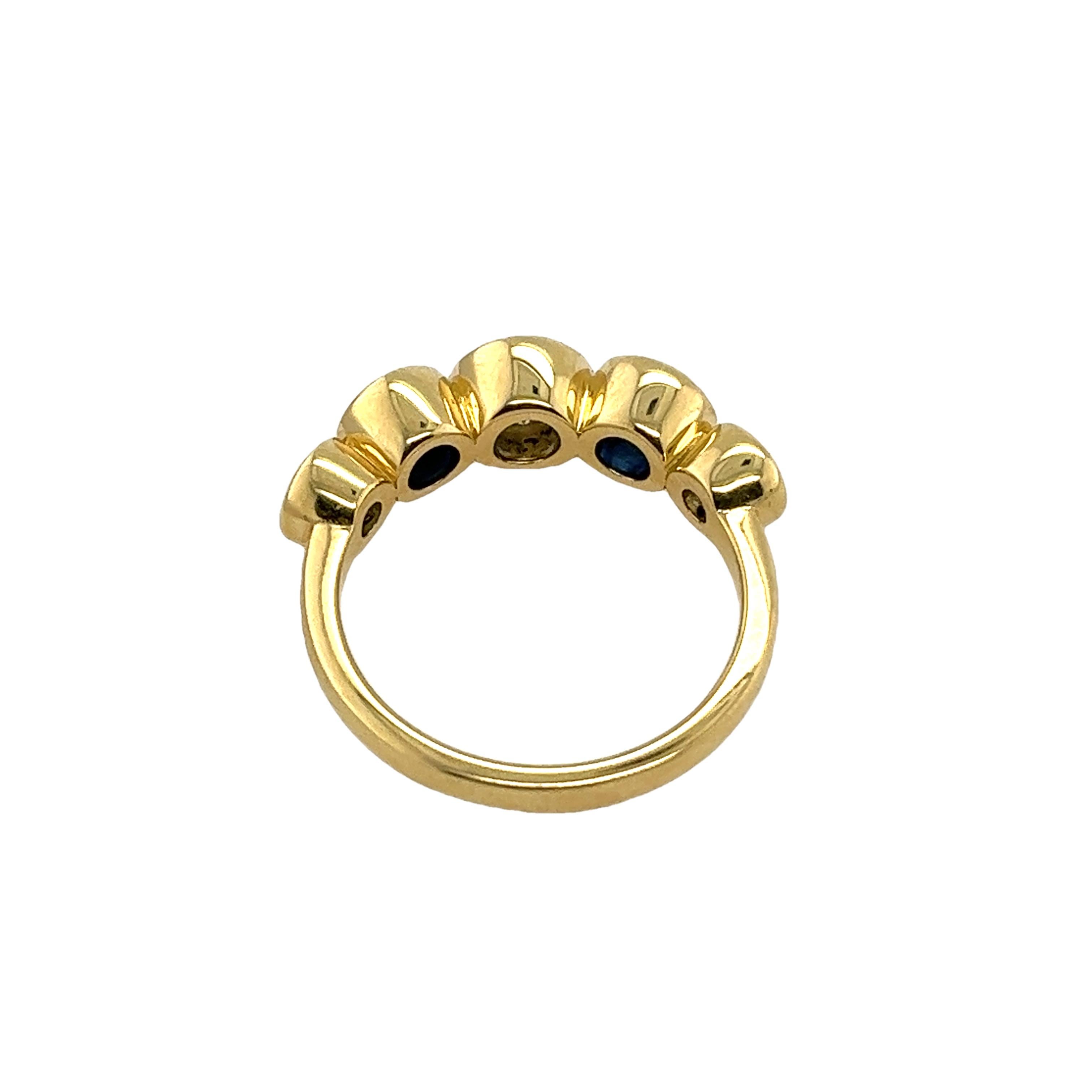 This gorgeous diamond 4-stone ring 
set in an 18ct yellow gold setting, 
with 3 natural round brilliant cut diamonds and 2 sapphires.
This is a unique and eye-catching ring.
Total Diamond Weight: 0.87ct
Diamond Colour: D-H
Diamond Clarity: