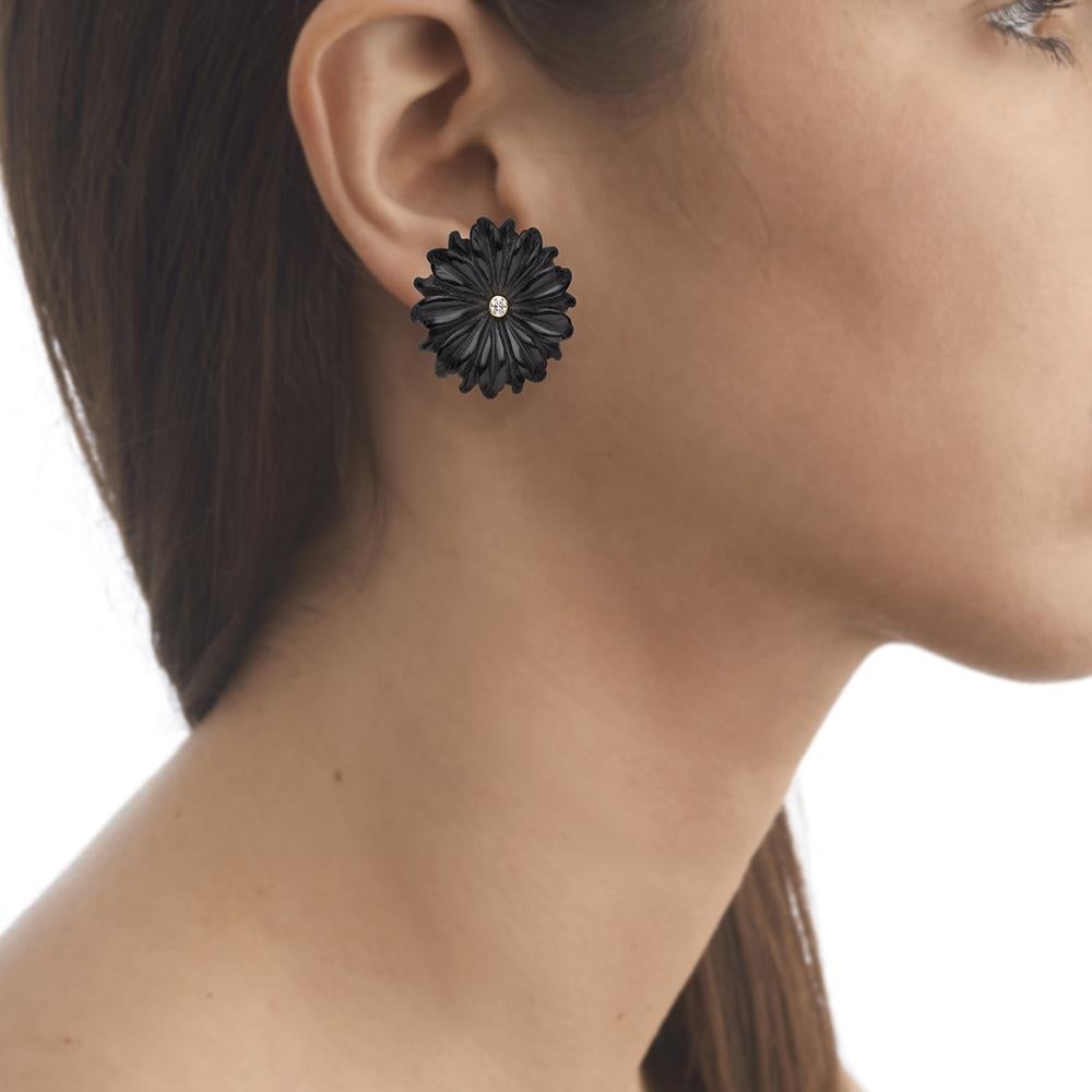 18ct yellow gold, diamond and hand-carved onyx earrings
Hallmarked
One-of-a-kind

The Whoops-a-Daisy Earrings are inspired by the designer's vivid childhood memories of British summers spent in the park making daisy chains. Pair with Tessa Packard