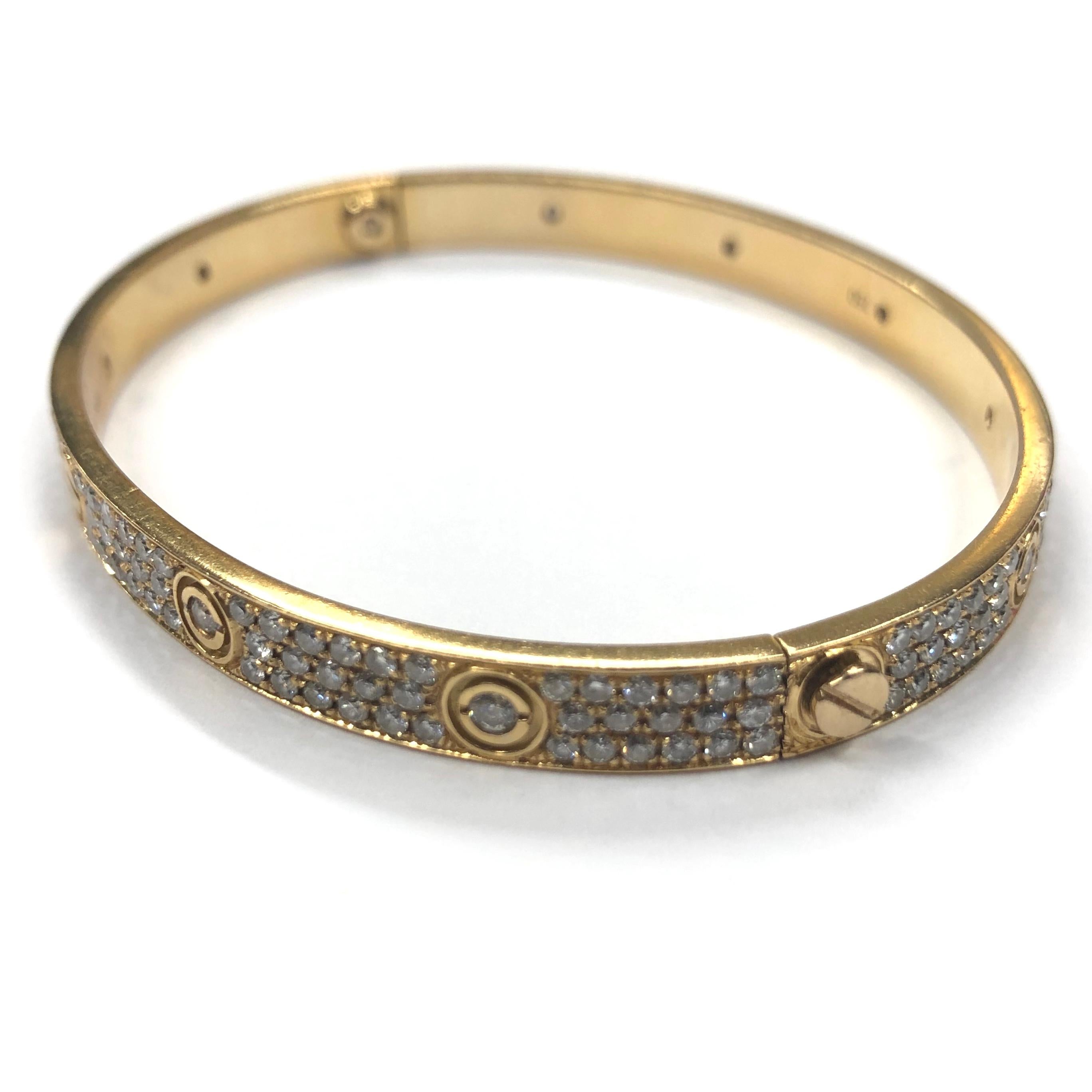 18ct Yellow Gold Diamond Cartier Love Bangle. Set with three rows of round brilliant cut diamonds and nine round brilliant cut diamonds in the screws.

Approximate total Diamond weight : 5.00ct
Bangle size : 20
Total weight : 29.3g