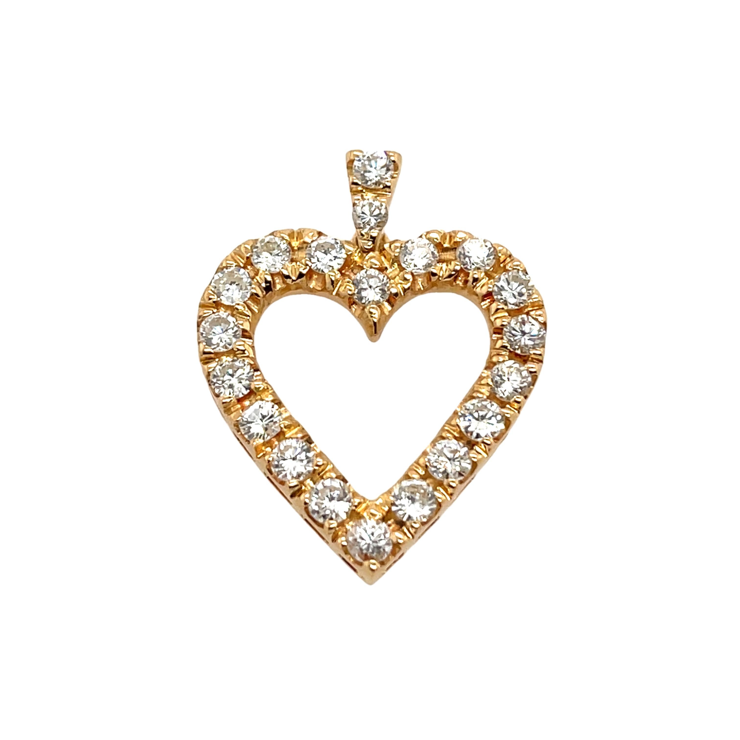 This beautiful 18ct yellow gold heart pendant is set with 1.0ct of sparkling natural diamonds. The heart design symbolizes love and elegance, making it the perfect accessory for adding a touch of timeless luxury to any outfit.

Total Diamond Weight: