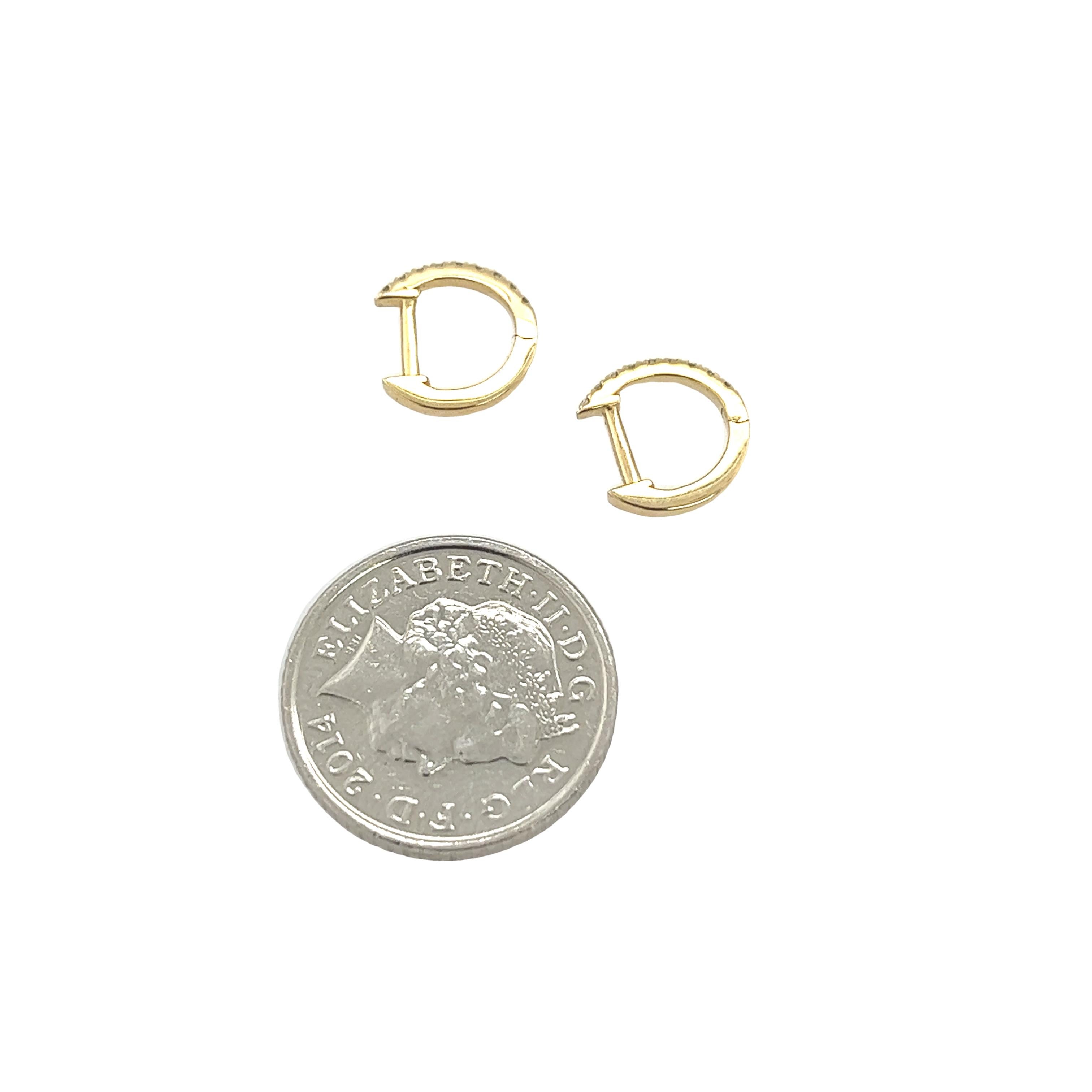 These earrings measure 9mm in diameter and are set with 0.08ct of round diamonds. They are a great choice for women who loves to wear jewellery that is both classy and elegant. These earrings are a perfect choice for any occasion.

Total Diamond