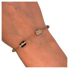 Bracciale in oro giallo 18 ct con diamanti, madreperla e onice nera