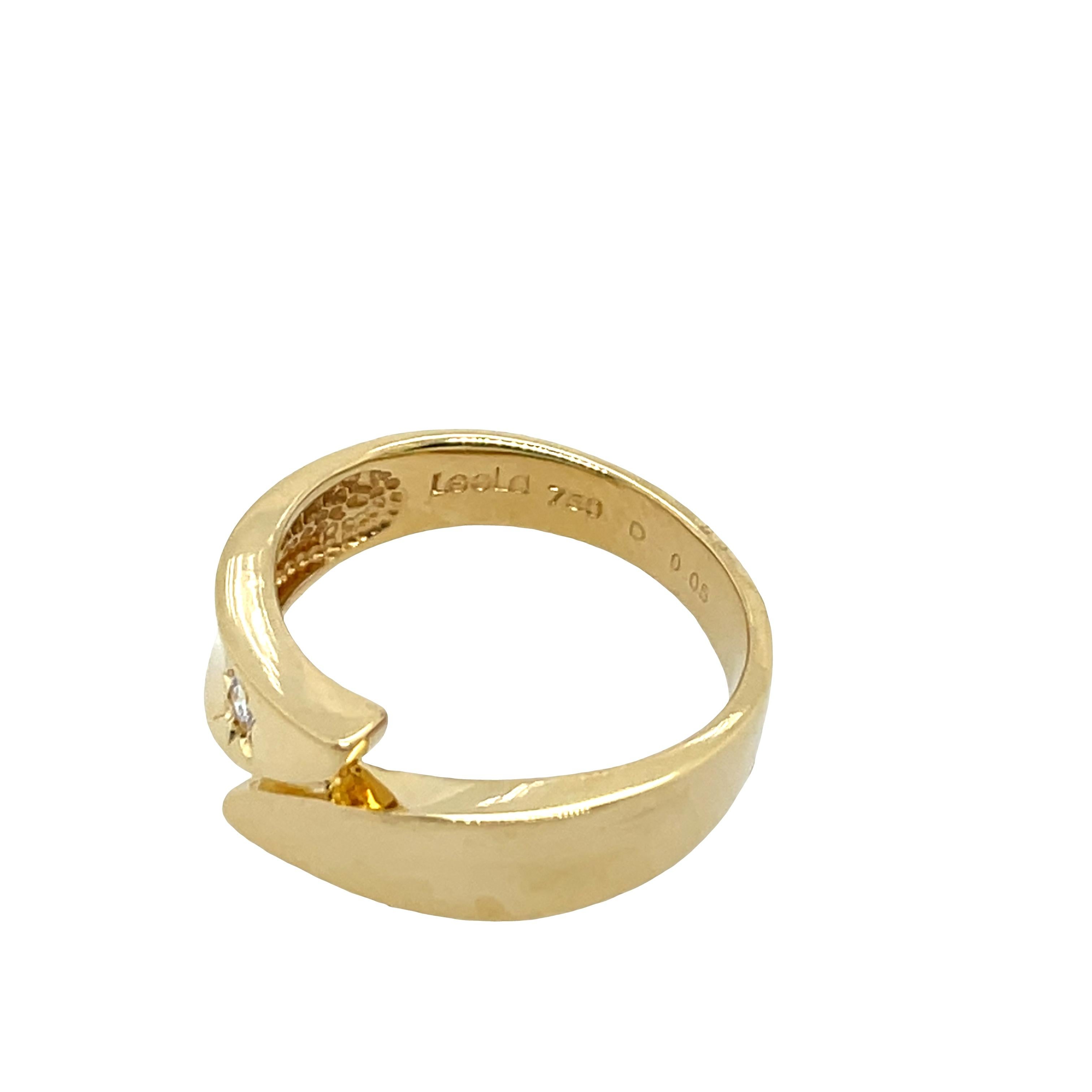 A delicate and timeless piece, this elegant ring is crafted from 18ct yellow gold and set with a 0.05ct natural round diamond at its center. 
Perfect for everyday elegance or as a minimalist stacking ring making it a perfect choice for any special