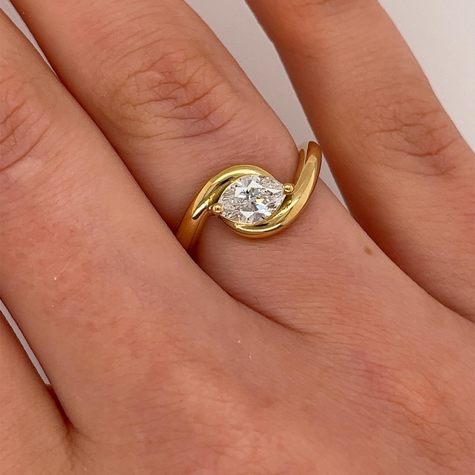 Indulge in timeless elegance with this exquisite 18ct yellow gold ring, 
featuring a stunning 0.70ct marquise-cut natural diamond. 
With its brilliant D color and SI2 clarity, 
this diamond radiates exceptional sparkle and sophistication, 
making it
