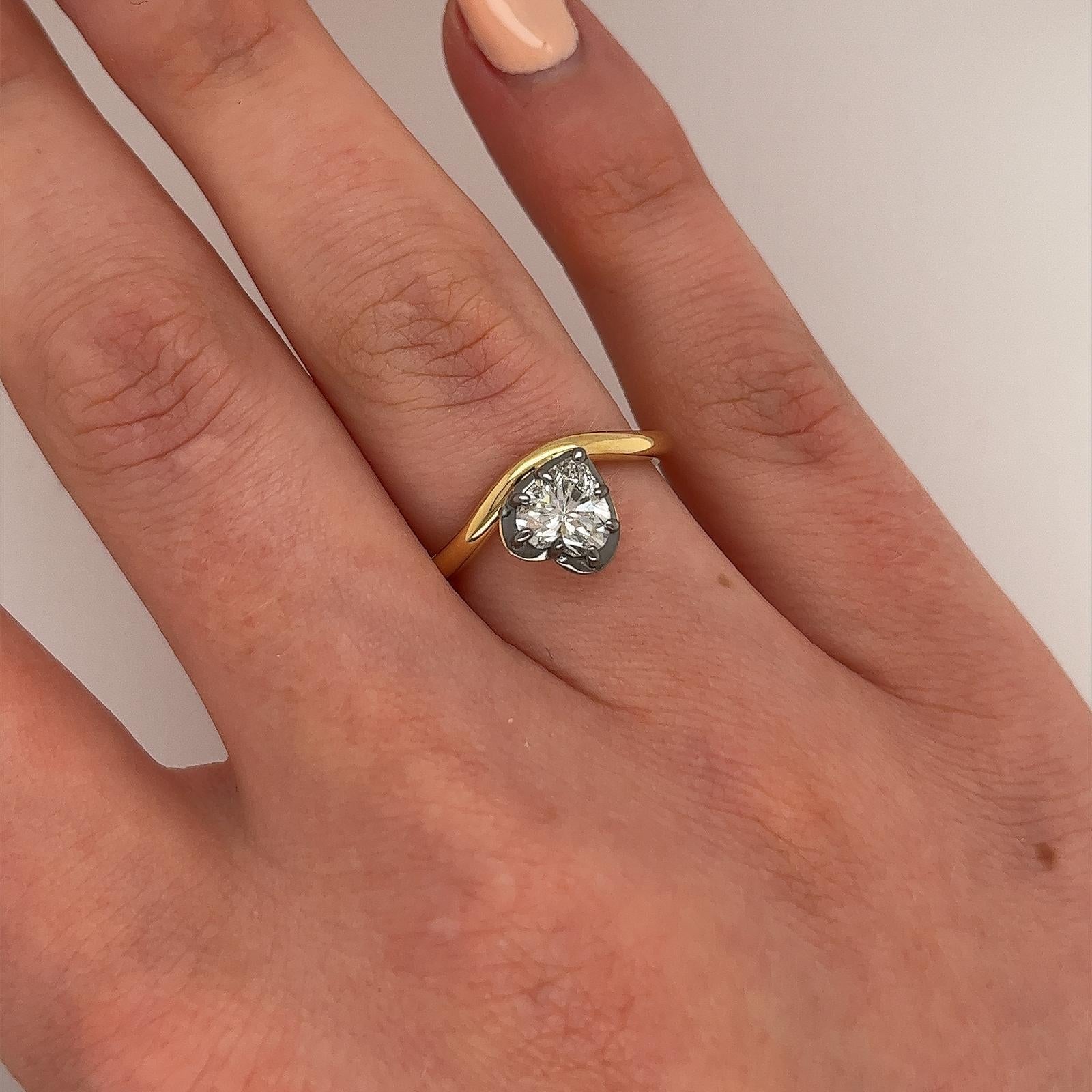 Indulge in timeless elegance with this stunning 18ct yellow gold ring, featuring a heart shape 0.93ct natural diamond. 
With its exceptional H colour and VS2 clarity, 
this diamond showcases remarkable sparkle and purity, 
making it a perfect choice