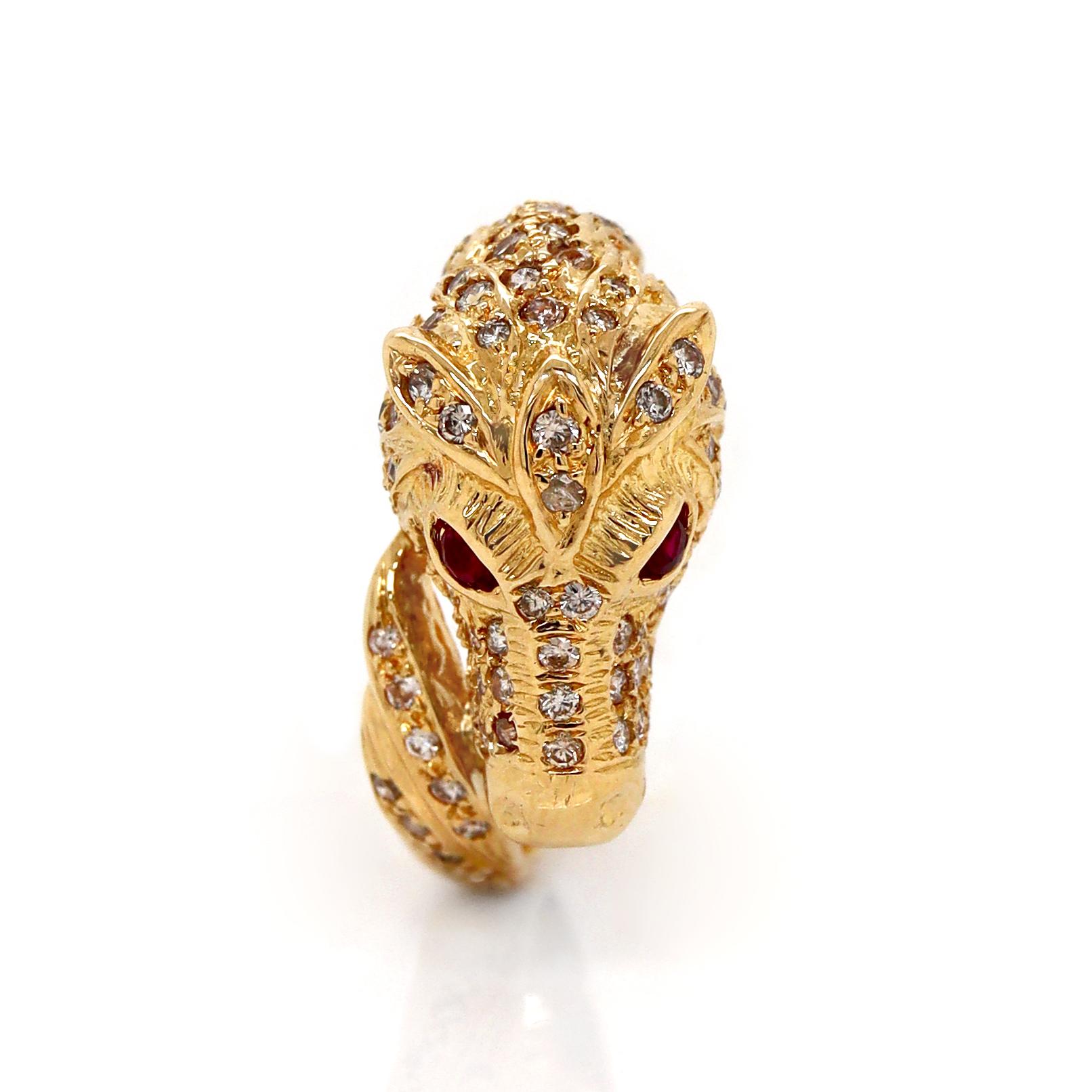 18ct Yellow Gold Diamond Ruby Emerald Horse Ring

This exquisite 18ct yellow gold ring is masterfully crafted in the shape of a horse's head, designed as a wraparound piece that elegantly encircles the finger. The horse's eyes are set with vibrant