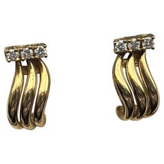 Orecchini in oro giallo 18ct con diamanti incastonati, Est 0,18ct, H/SI.