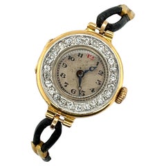 Montre en or jaune 18ct avec diamants et bracelet en cuir