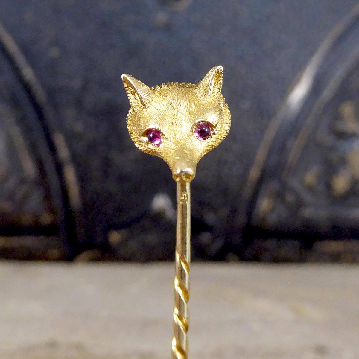 Typically used in the Edwardian era as a pin or brooch whilst hunting, this Fox Head has been hand crafted in 18ct Yellow Gold, with Cabochon Ruby set eyes. This 15ct Yellow Gold antique pin shows such quality craftsmanship with great detailing to
