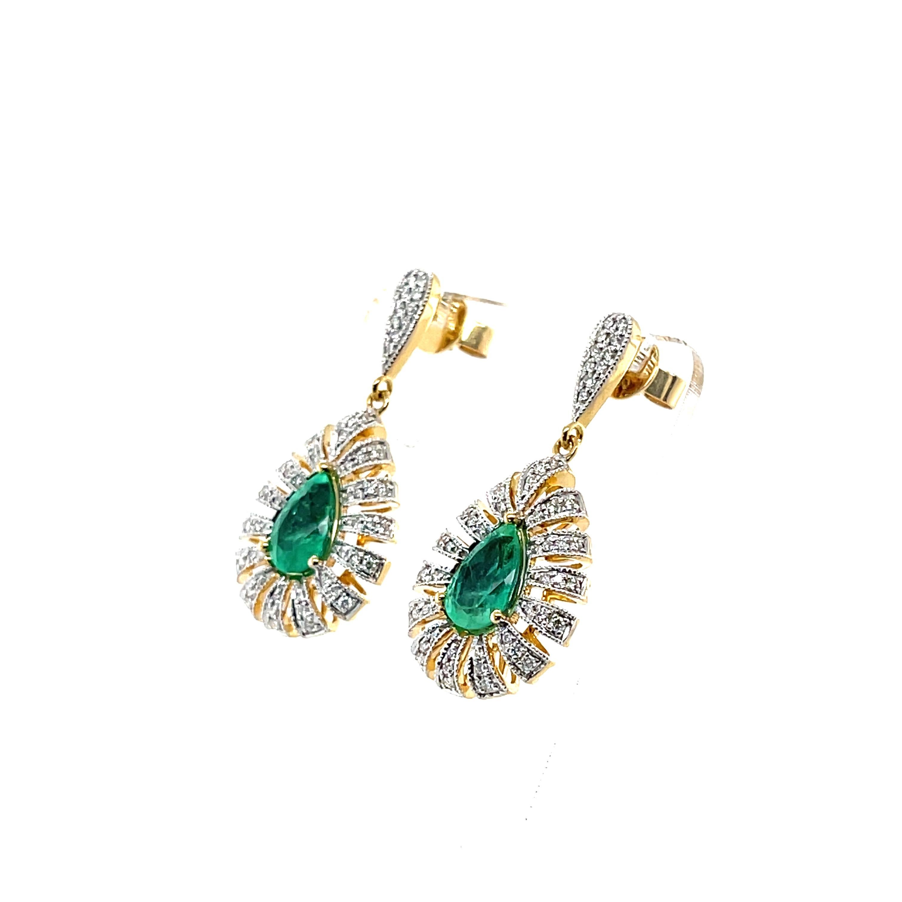 Pear shaped emeralds, crafted in Eighteen Karat yellow gold, featuring a beautifully set one hundred and ten claw set round brilliant cut diamonds, complimented by a beautiful polish finished design. 

Emerald Weight: 2.42ct
Emerald Colour: