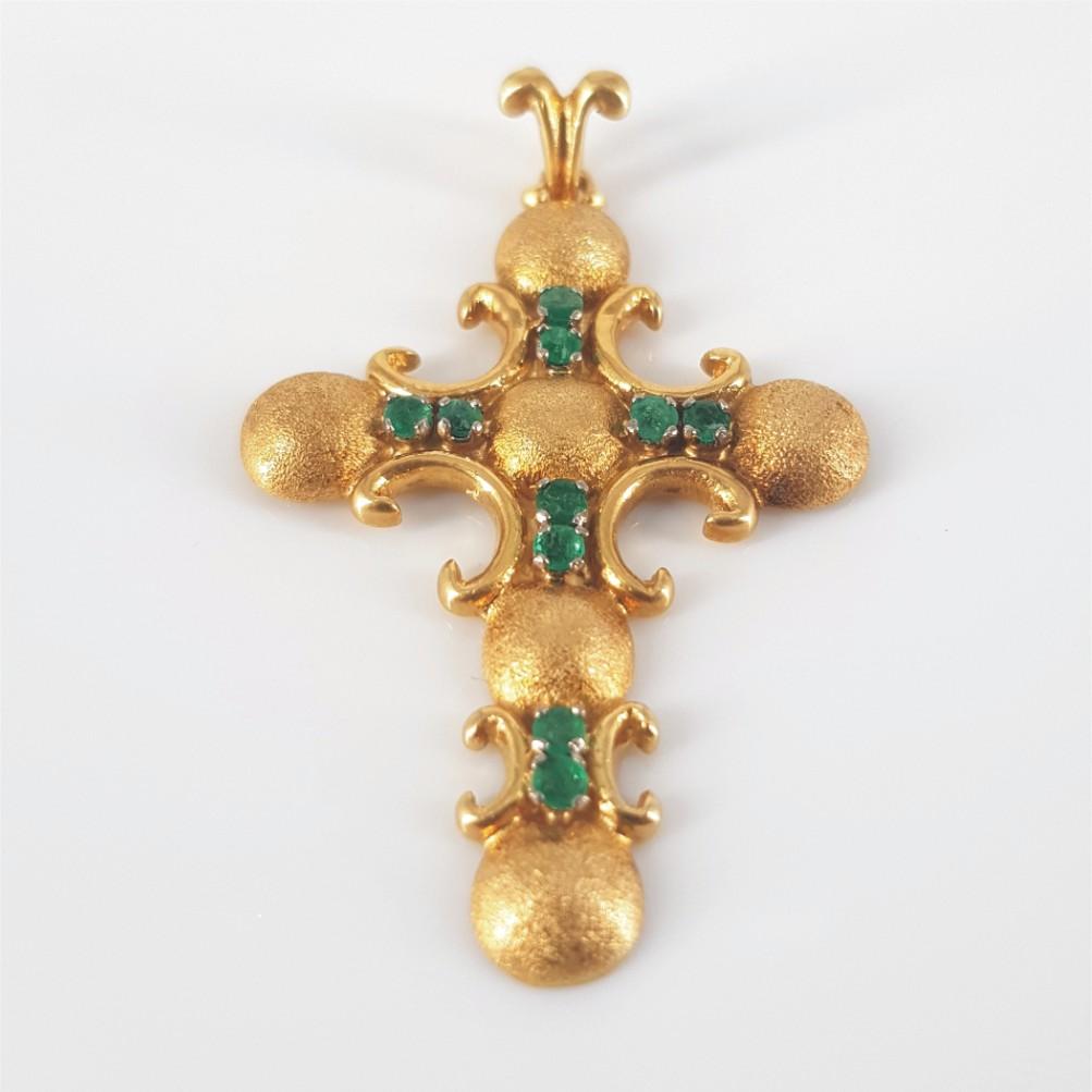 This Gorgeous 18 carat yellow gold cross pendant is carefully set with 10 beautiful round brilliant cut emeralds weighing 0.8 carat in total of standard quality and measuring 2.5mm. This Pendant is 49mm in length and weighs 8.4 grams.