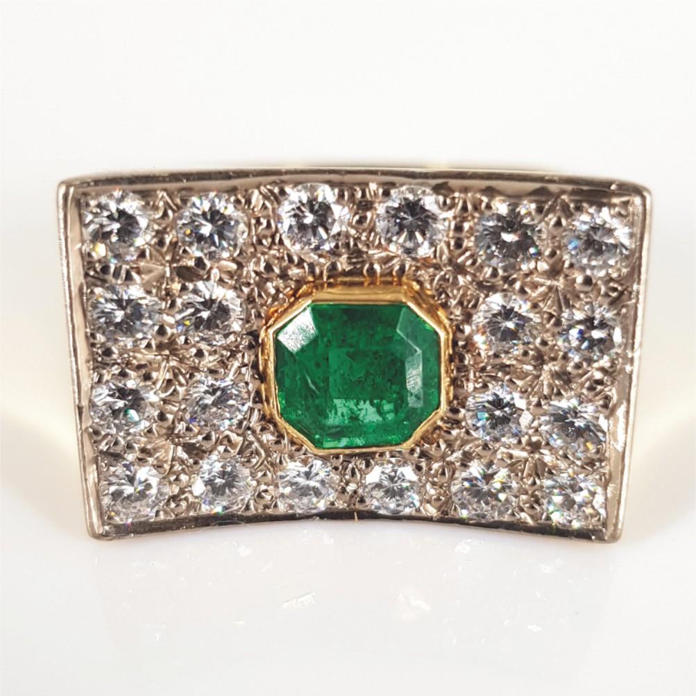 Striking, beautiful and bold, this ring says it all. Set in 18carat yellow gold and weighing 8.1 grams, this ring features 20 RBC Diamonds weighing a total of 1carat of GH/vssi quality and 1 Octagon Cut Emerald measuring 6mm x 6mm with an estimated