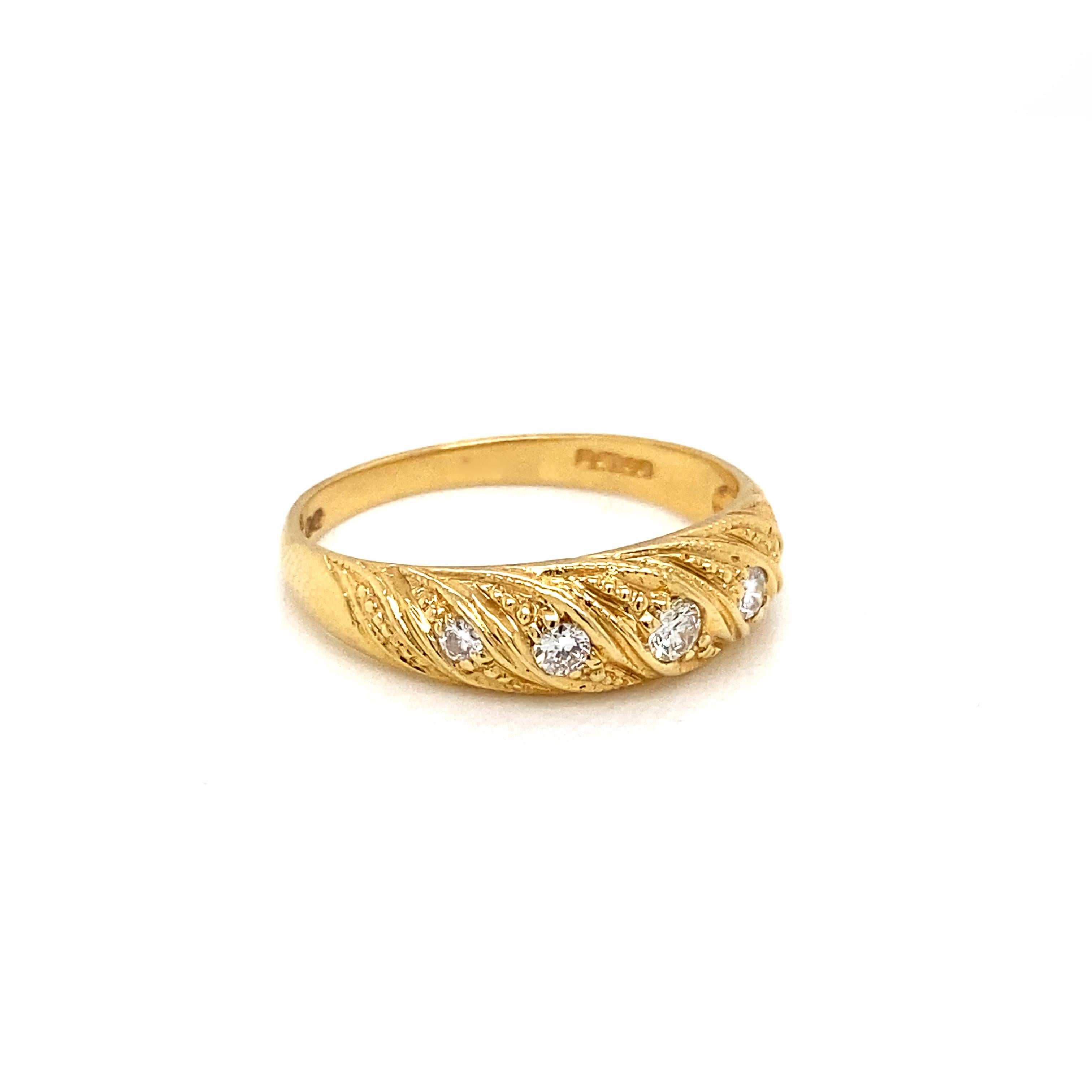 Complement your jewellery collection with this classic and elegant domed band ring, expertly crafted from rich 18 carat yellow gold.

The beautiful ring features a meticulously carved twisted design with delicate millgrain detailing that evokes the