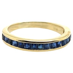 Bague demi-éternité en or jaune 18ct avec saphir naturel