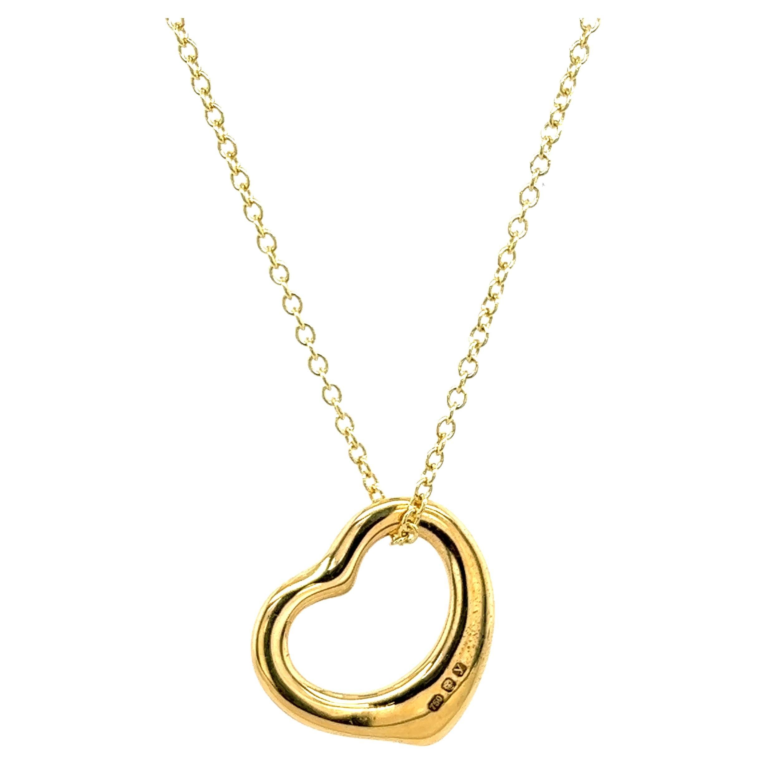 A beautiful 18ct Yellow gold heart shape pendant suspended from a 20