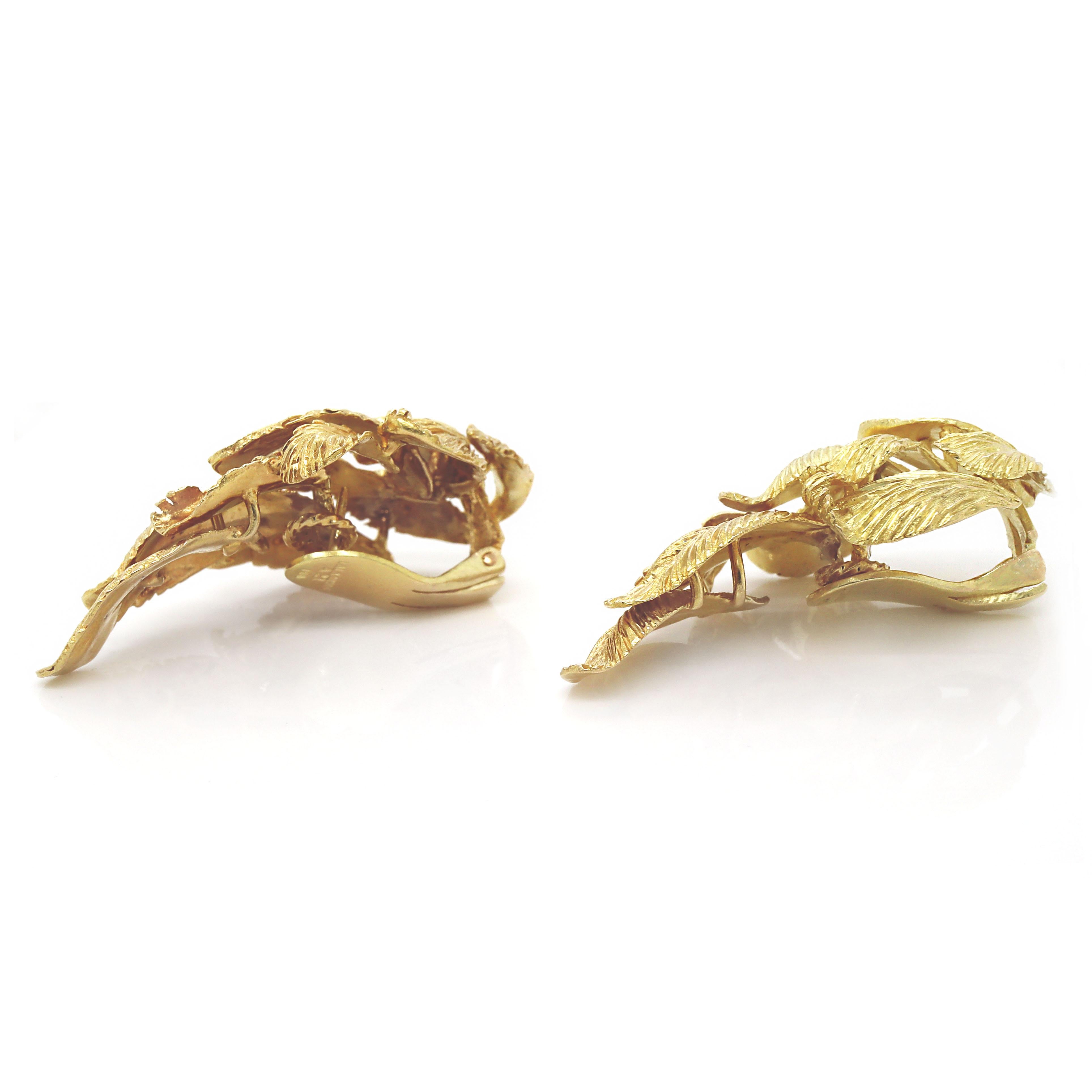 18CT Yellow Gold Illias Lalaounis Leaf Earrings

A pair of 18ct yellow gold leaf earrings by renowned Greek jeweler and designer, Ilias Lalaounis is not just a jeweler but an artist whose work embodies the fusion of history, nature, and artistry,