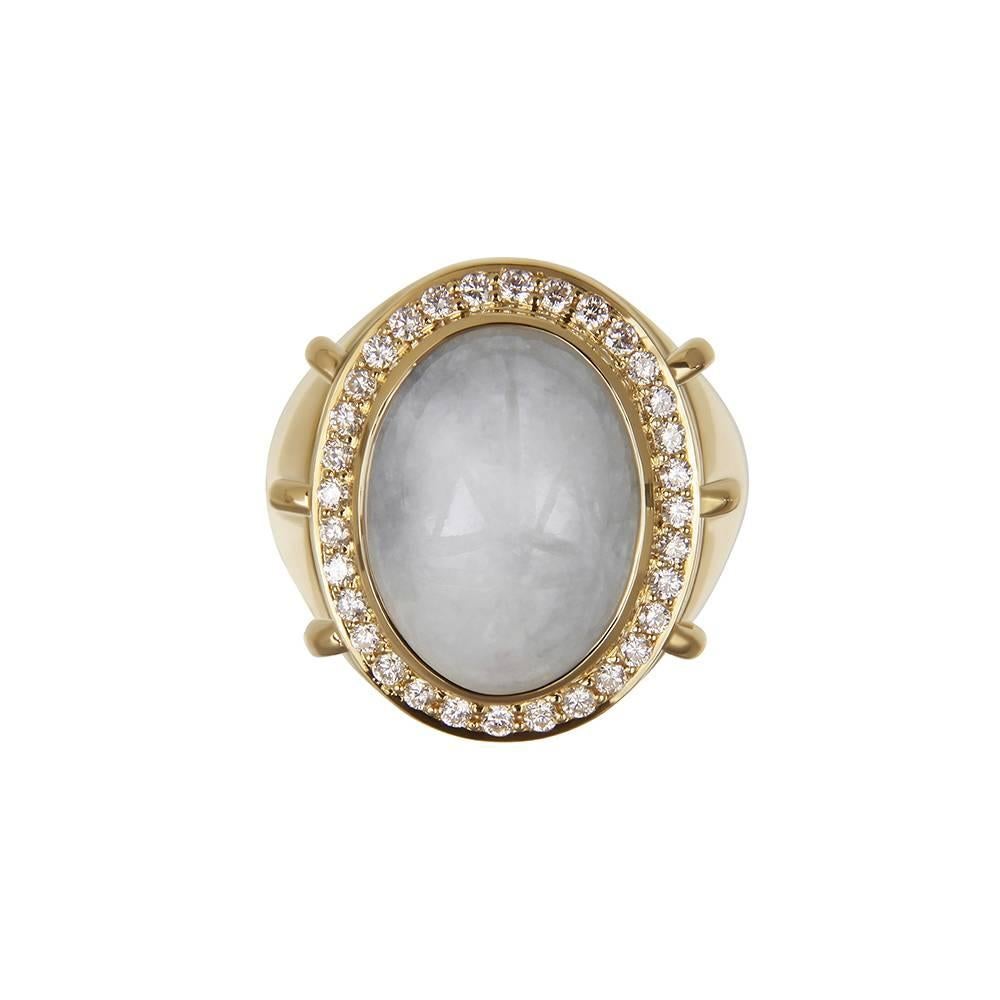 18ct yellow gold, hand-carved jadeite and diamond ring
Hallmarked
Ring size UK N/O

This stunning cocktail ring is set with a large, carved jadeite cabochon encircled by white diamonds. As the name suggests, this piece draws its inspiration from the