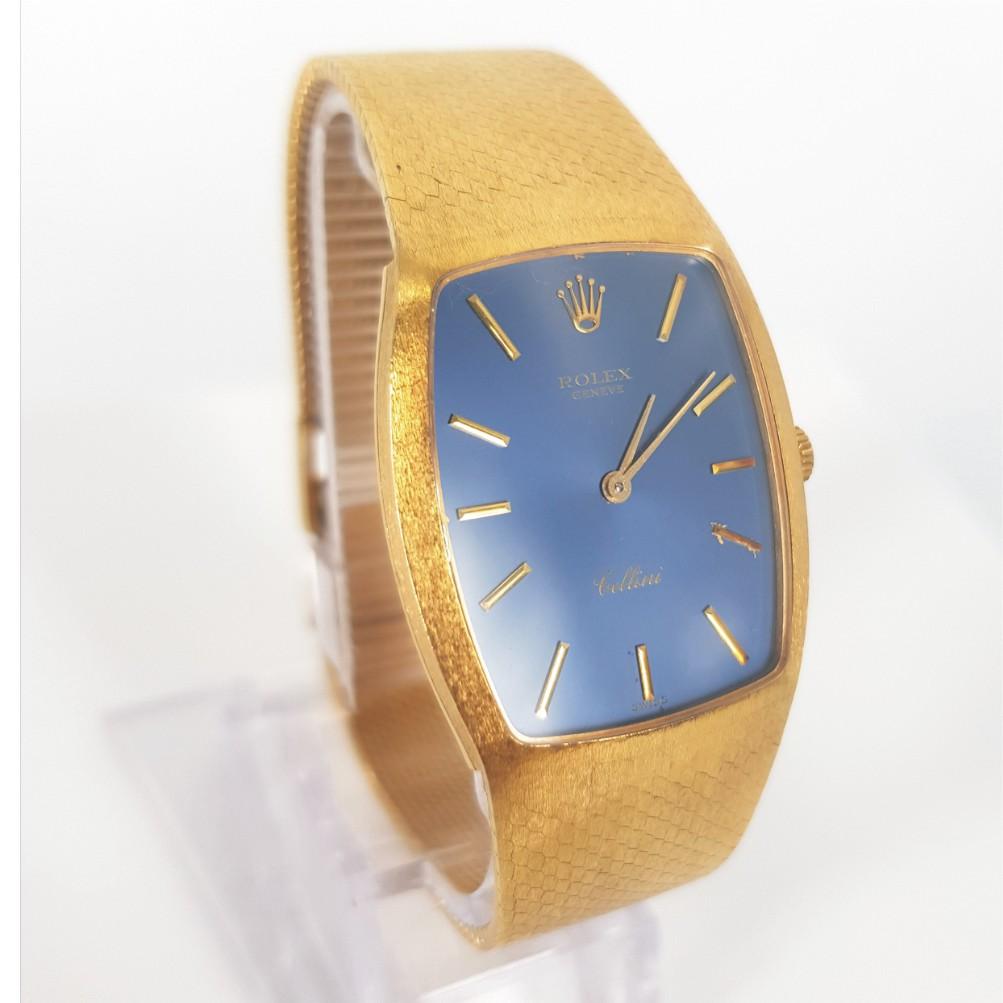 18ct Yellow Gold Ladies Rolex Cellini Watch (Modified) - Quartz in good condition. 
Model/Serial Number: 4312920
18ct yellow gold case (28mm inc crown). Navy Blue dial with gold hands. Integrated 14ct yellow gold mesh style bracelet (50mm).
