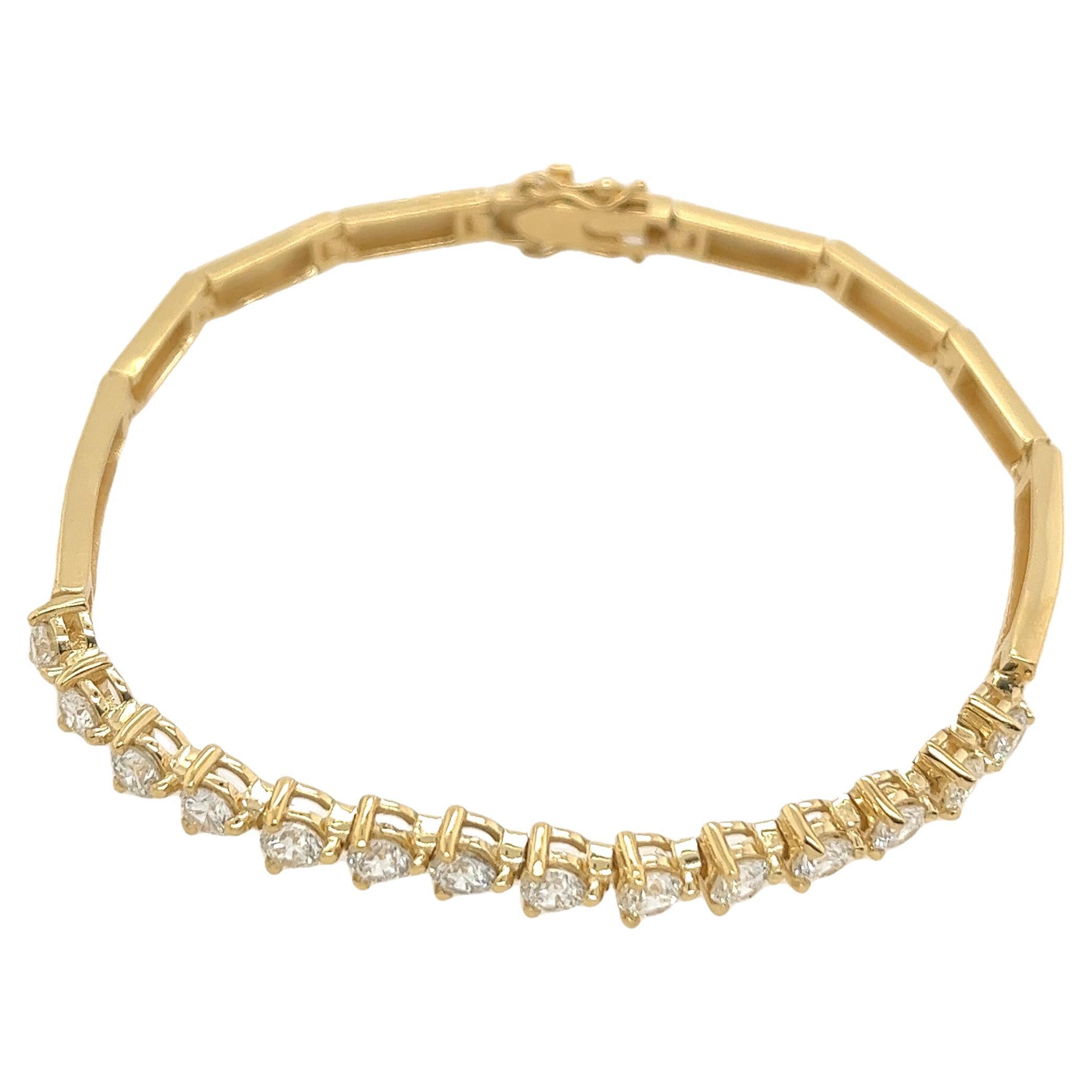 This bracelet is made of 18ct yellow gold and set with 14 round brilliant cut natural diamonds, and has a beautiful shiny finish. This design is ideal for everyday wear.

Total Diamond Weight: 2.25ct
Total Weight: 12.6g
Bracelet Length: 7