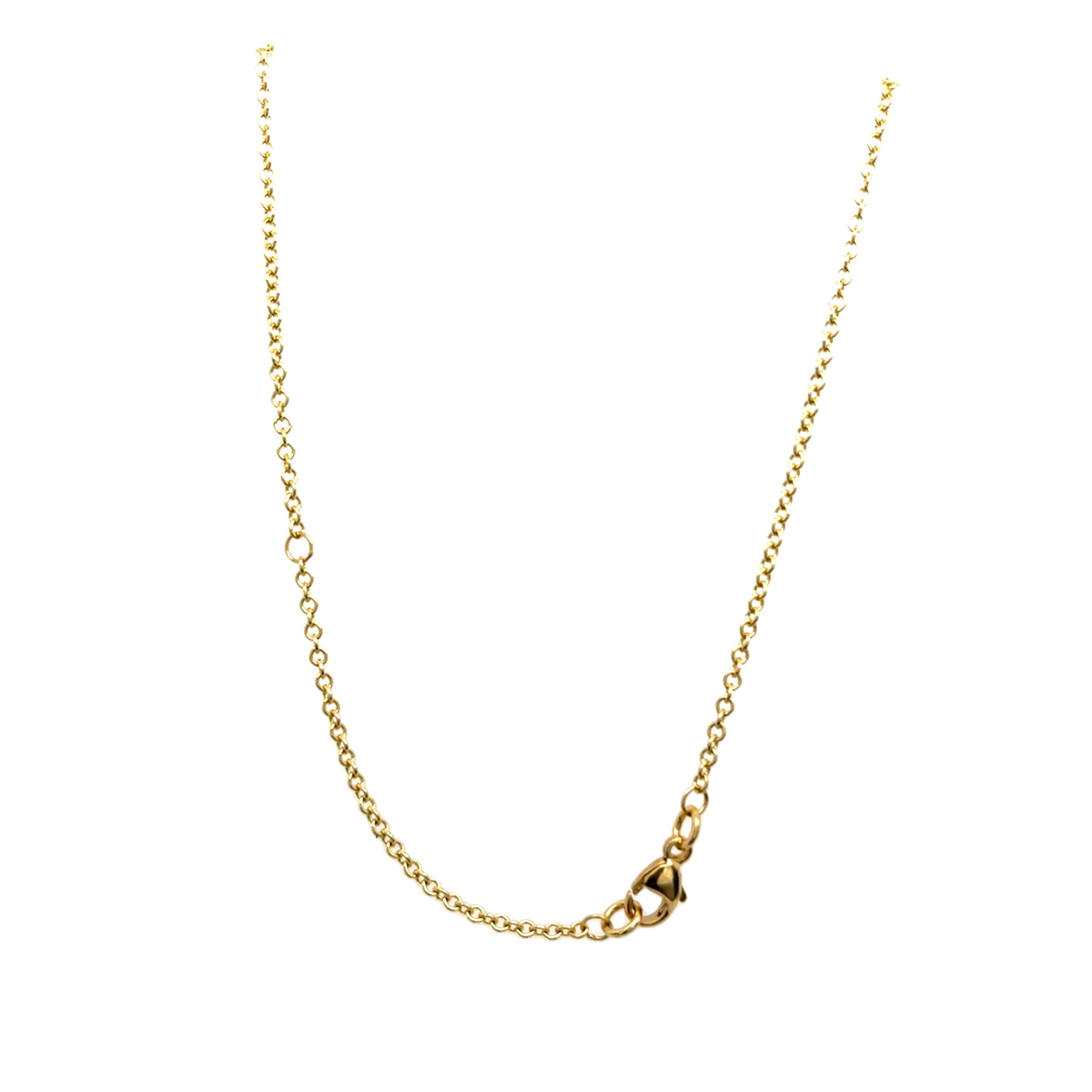 Eine exquisite Halskette aus 18 Karat Gelbgold mit einem auffälligen ovalen Tsavorit in der Mitte, ergänzt durch sechs baumelnde natürliche Diamanten, die für zusätzliche Brillanz und Bewegung sorgen. Der satte Grünton des Tsavorits kontrastiert