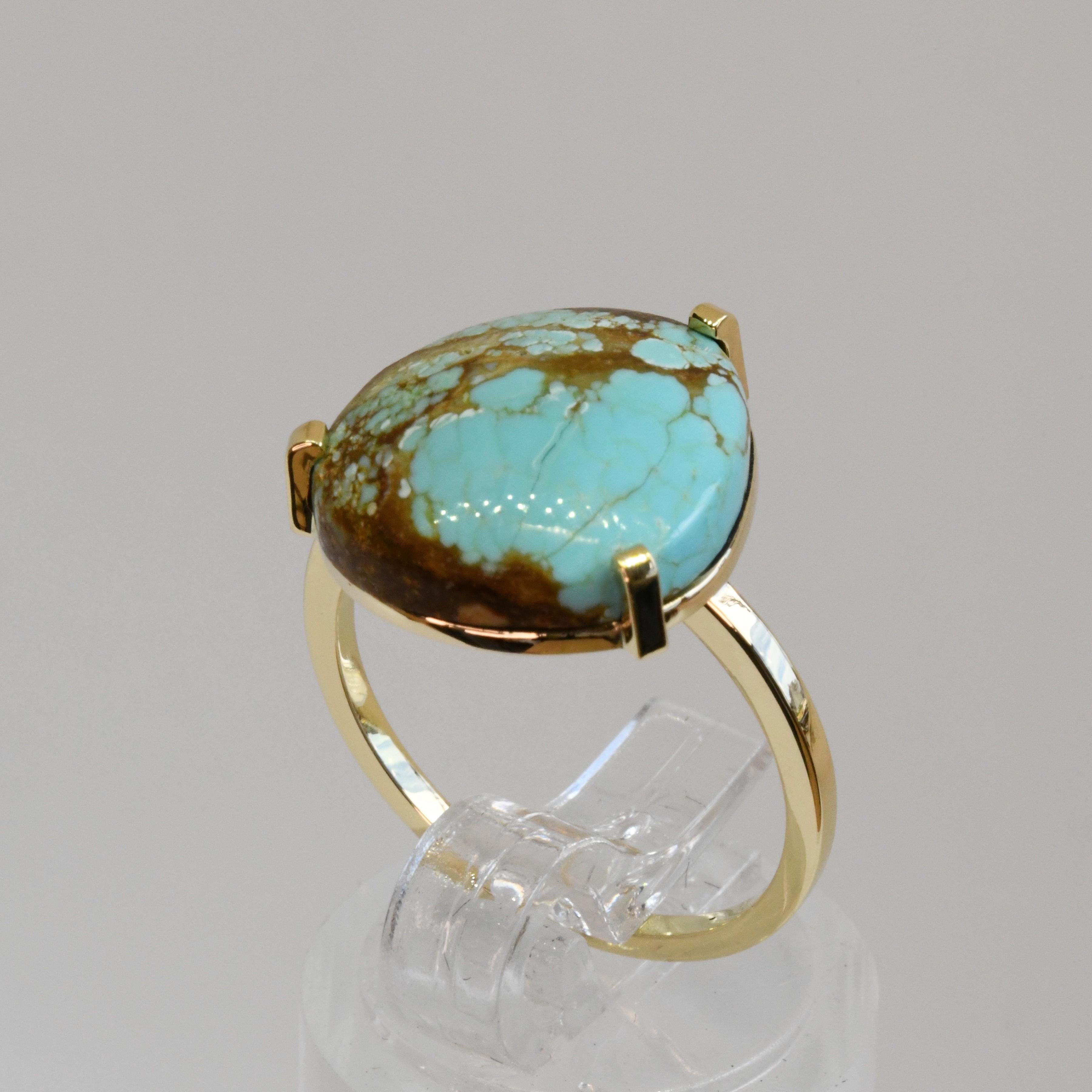 18ct yellow gold ring mounting a natural turquoise with honey golden matrix patterns from the now closed '8 mine' in Nevada.
'8 mine' turquoise is known by gemologists to be one of the rarest and highest quality grade turquoise available.

This