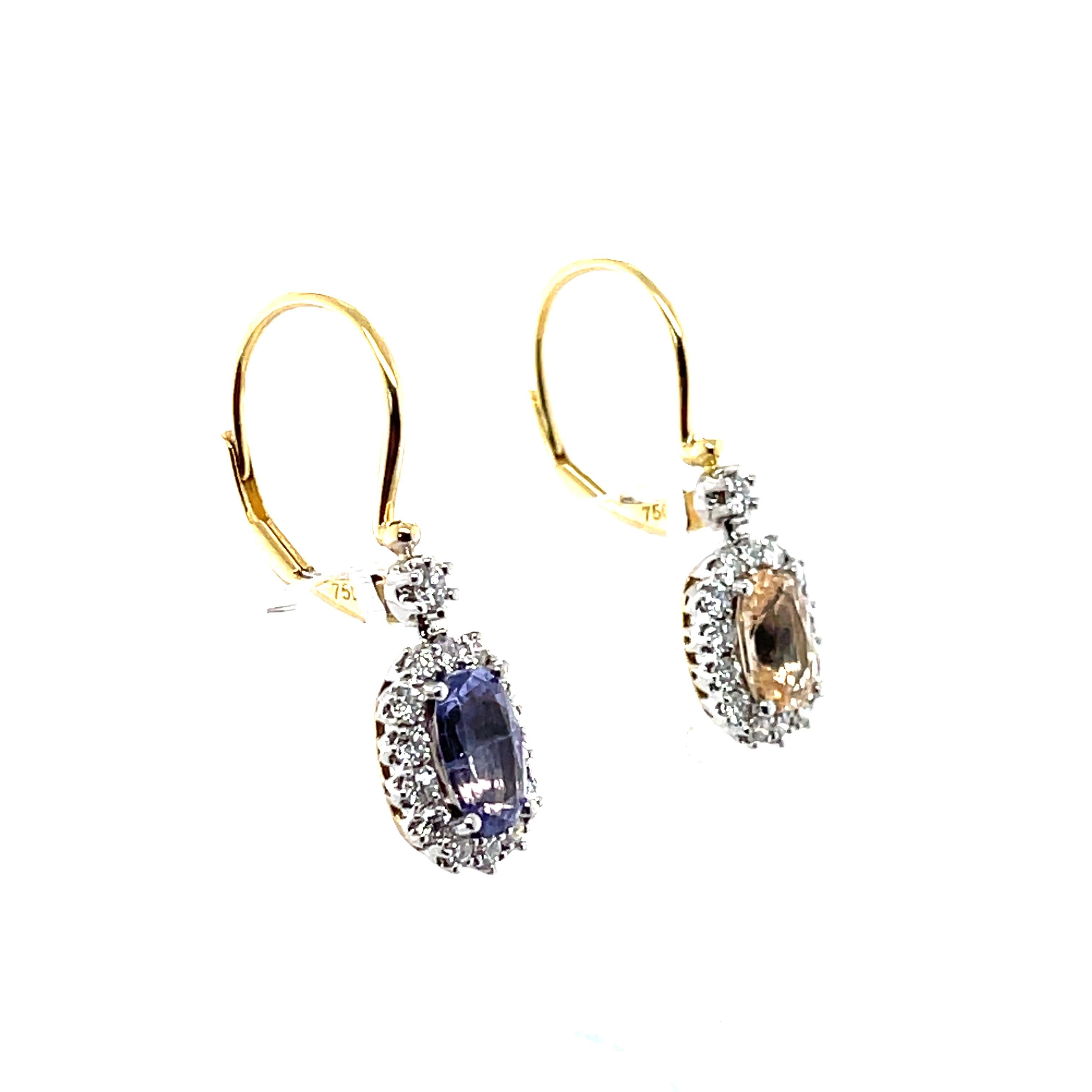 Claw set cushion and oval yellow and purple no heat sapphires, crafted with Eighteen karat yellow gold, promoting thirty claw set round brilliant cut diamonds, accompanies by a stunning polished finish design.

Sapphire Weight: 2.28ct
Sapphire