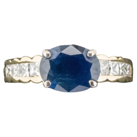 Condition: Good with mild/light scratches
Material: 18ct Yellow Gold 
Hallmarked: Stamped 750. Tests as 18ct Gold
Main Stone Identity: Sapphire
Main Stone Colour: Blue
Main Stone Total Carat Weight: Approx. 1.9ct
Secondary Stone Identity: