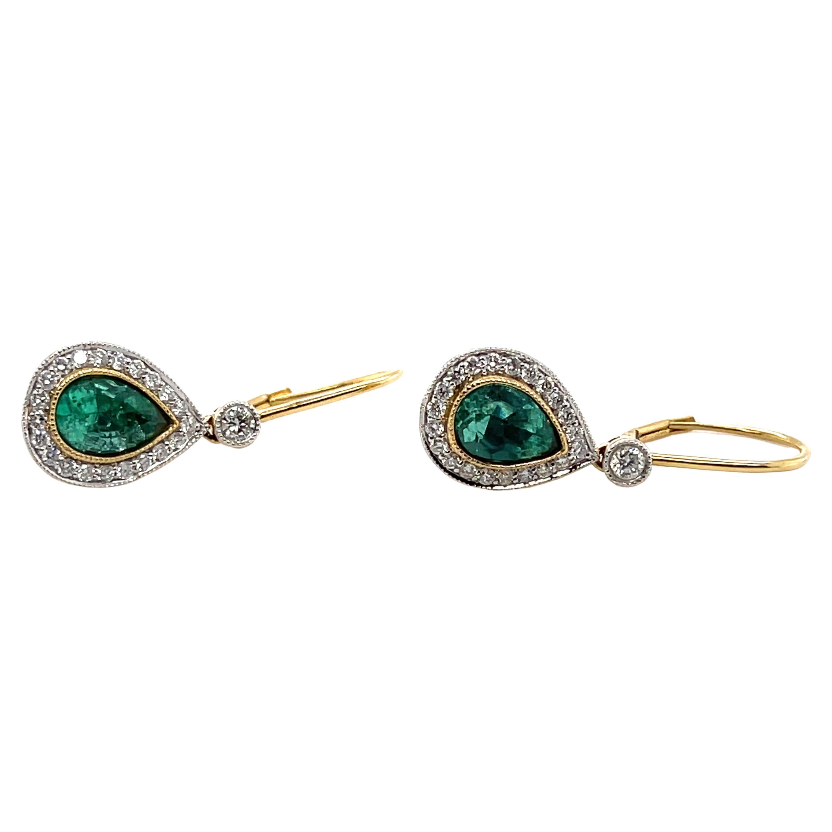 A set of Pear cut emeralds adjacent to stunning round brilliant cut diamonds embedded on French hoop designed earrings. 

Emerald Weight: 2.37ct 
Emerald Colour: 