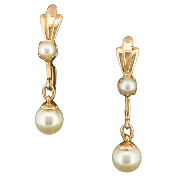 Condition: Pre-Owned with light/mild marks
Material: 18ct Yellow Gold 
Hallmarked: No. Tests as 18ct Gold
Main Stone Identity: Pearl
Main Stone Size: Small Pearl - 3.8mm Diameter Large Pearl - 6mm Diameter
Item Weight: 3.6g
Earring Drop Length: 30mm