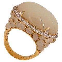18ct Yellow Gold Ring Set With A Moonstone Cabochon Surrounded By 80ct Diamonds