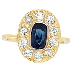 18ct Yellow Gold Ring Set with Sapphire with 10 round diamonds