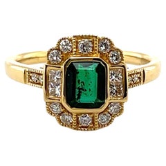 Bague en or jaune 18 carats avec émeraude de Colombie et diamant