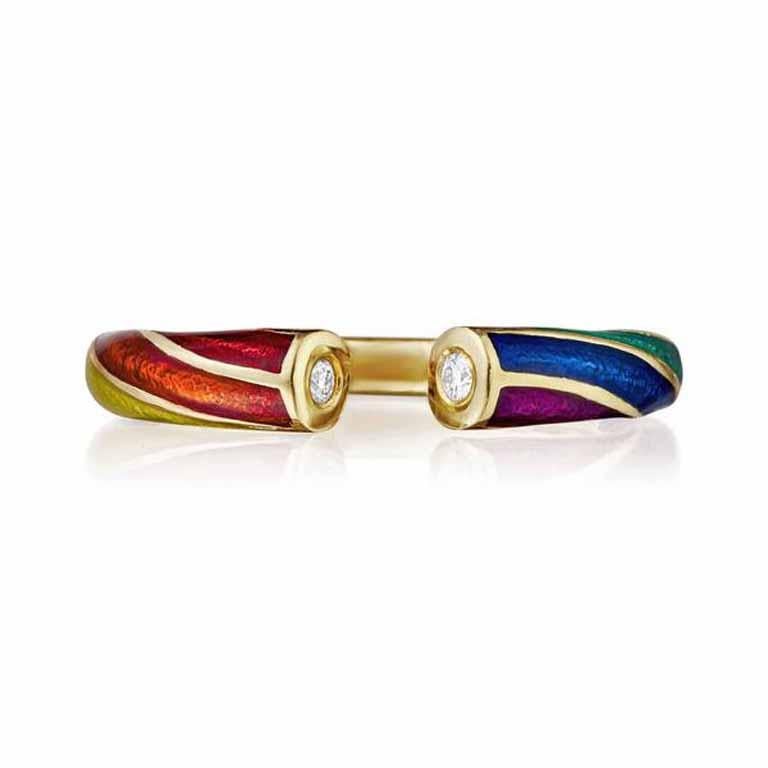 Get ready to relive the joyous memories of seaside trips and indulging in a stick of rock candy with this whimsical ring. Inspired by the sweet treat, this ring features a delightful spiral of vibrant colors that wraps playfully around your finger,