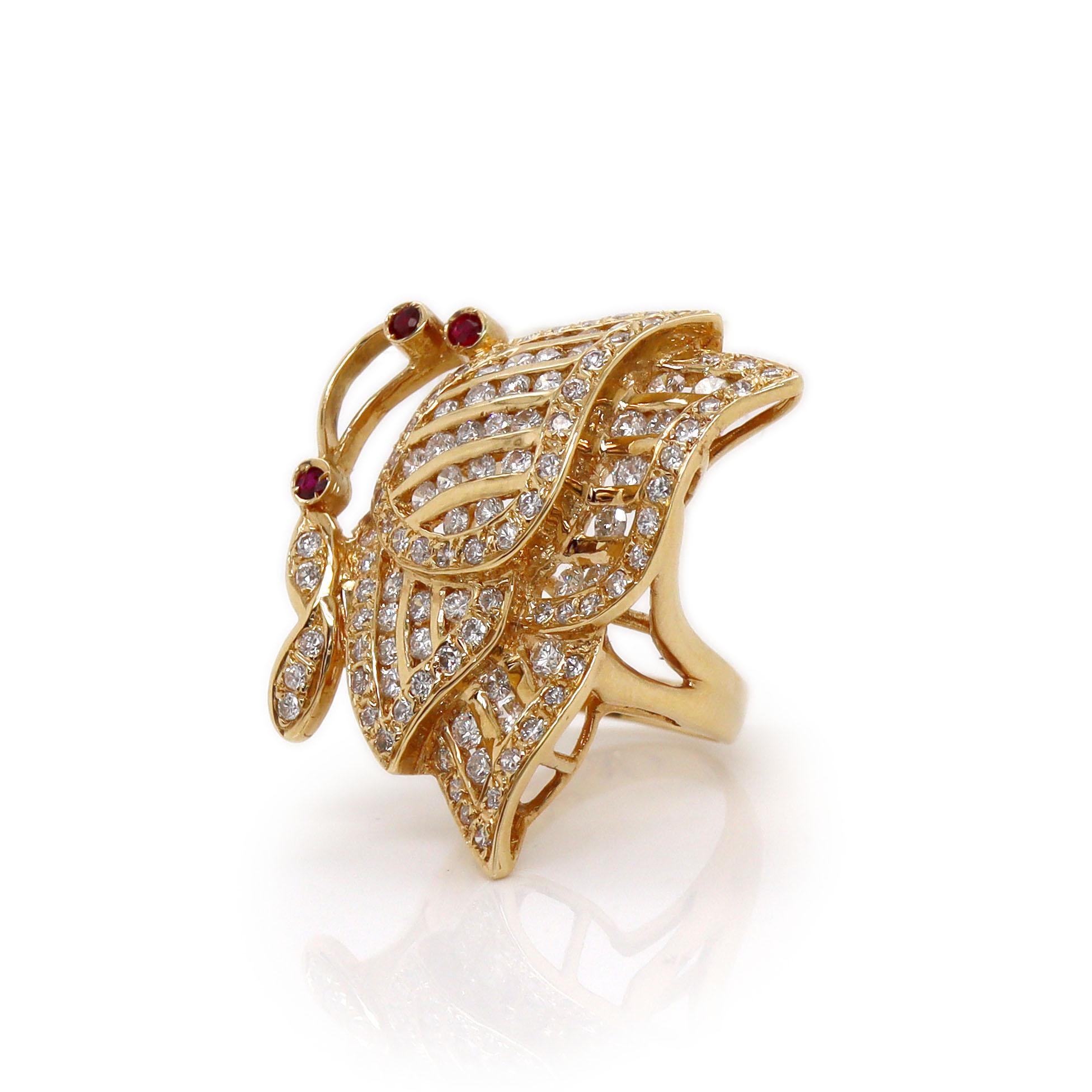 18ct Yellow Gold Ruby & Diamond Butterfly Ring

This stunning 18ct yellow gold ring is intricately designed in the shape of a butterfly in mid-flight, capturing the grace and beauty of nature. The wings of the butterfly are adorned with channel-set