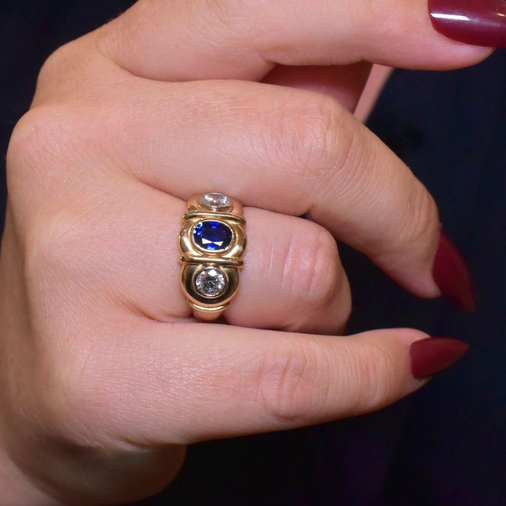 Crafted from 18ct yellow gold and Platinum (both large diamonds are each Platinum set) in very substantial fashion, this ring weighs an incredible 11.2 grams, which feels simply divine on the finger.

Centred with a luscious natural Ceylon type blue