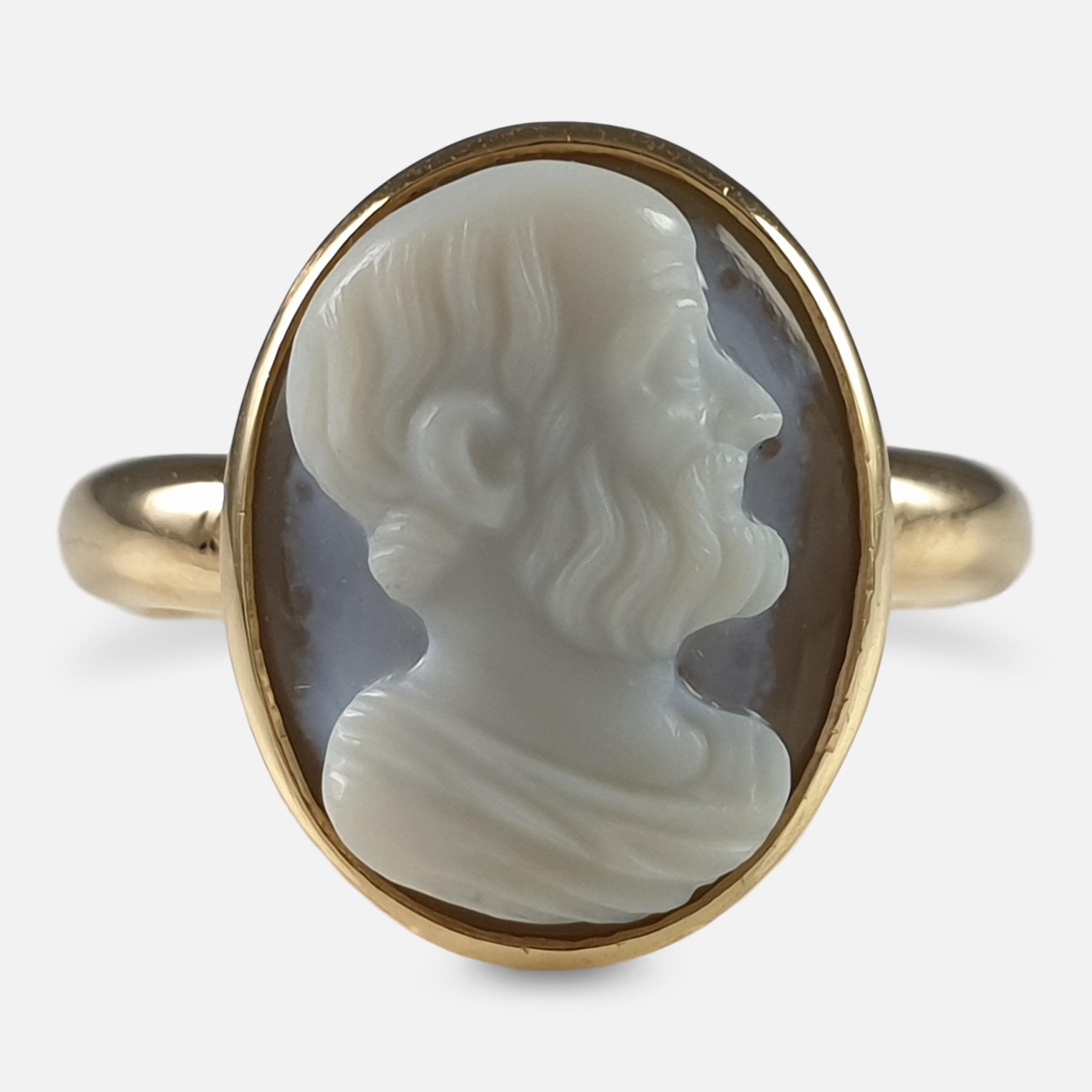 An 18ct yellow gold cameo ring. The 19th century sardonyx cameo, depicting a man with head in profile facing right, having short hair, aquiline nose, and a beard.

The cameo is rub over set with a closed back, on a later ring mount. The ring is