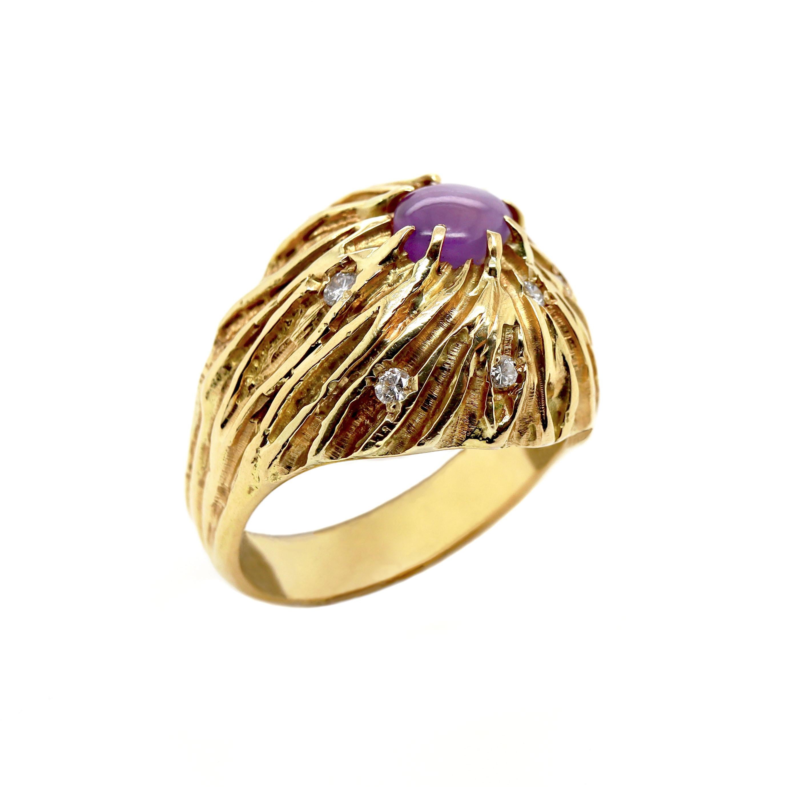 18CT Yellow Gold Vintage Star Ruby And Diamond Cocktail Ring

This vintage cocktail ring is an exquisite piece crafted in 18-carat yellow gold, evoking a sense of timeless elegance. Mesmerized by a cabochon cut Star Ruby that enhances the gemstone