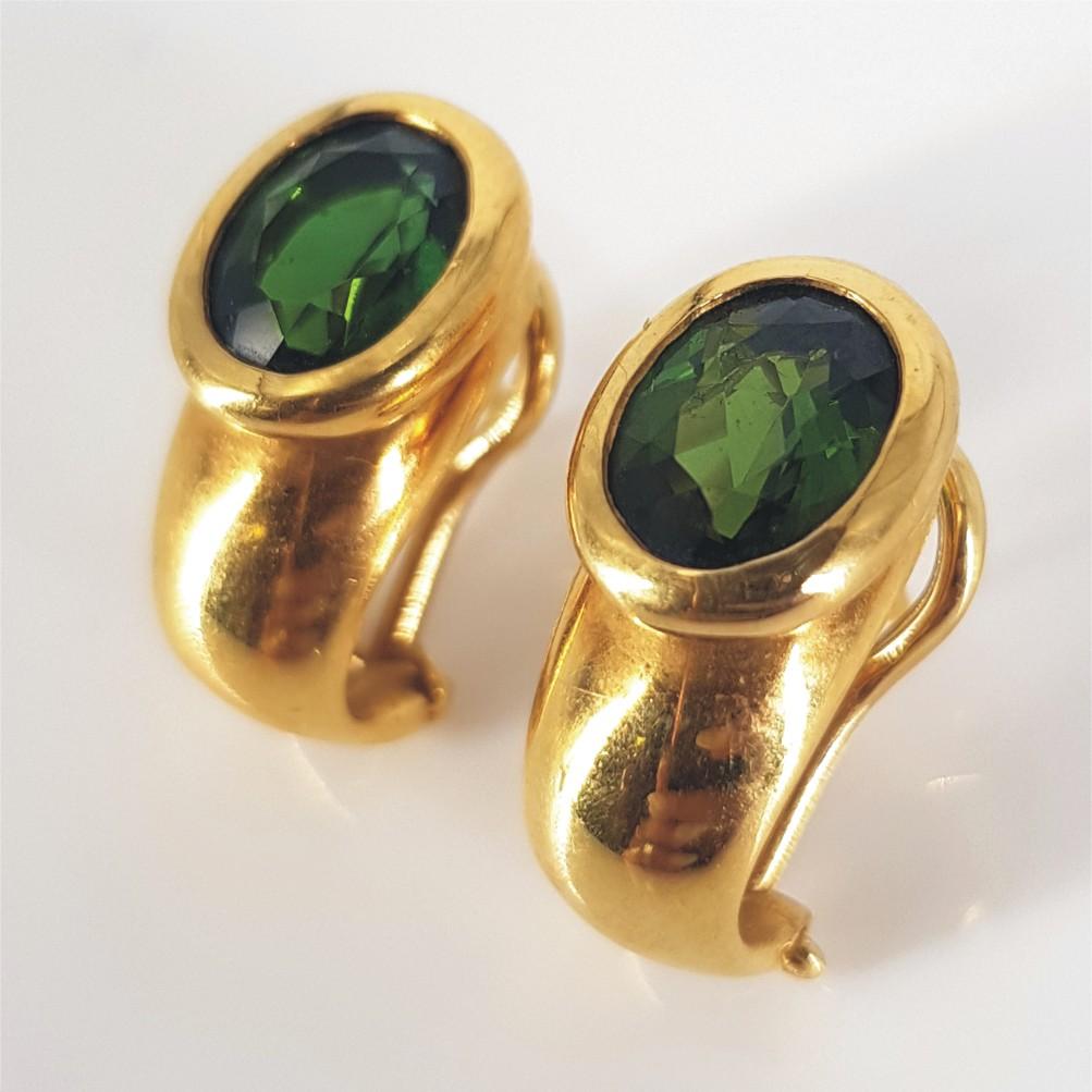 This Elegant and Classy pair of drop earrings (16mm x 9mm) are set in 18Carat Yellow Gold weighing 10grams. They feature 2 Oval Cut Green Tourmaline’s Measuring 2mm x 7mm x 9mm.