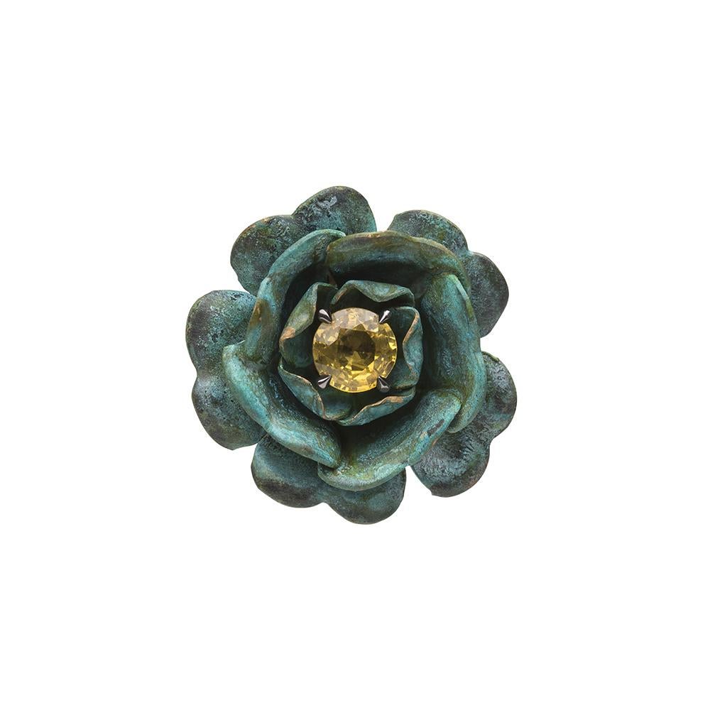 18ct yellow gold, verdigris brass, rhodium and yellow sapphire ring
One-of-a-kind
Hallmarked
UK Ring size N/O. Can be resized to any ring size.

The Ring-a-Roses Ring takes its name from the eponymous, flower-themed Victorian nursery rhyme. Hailing