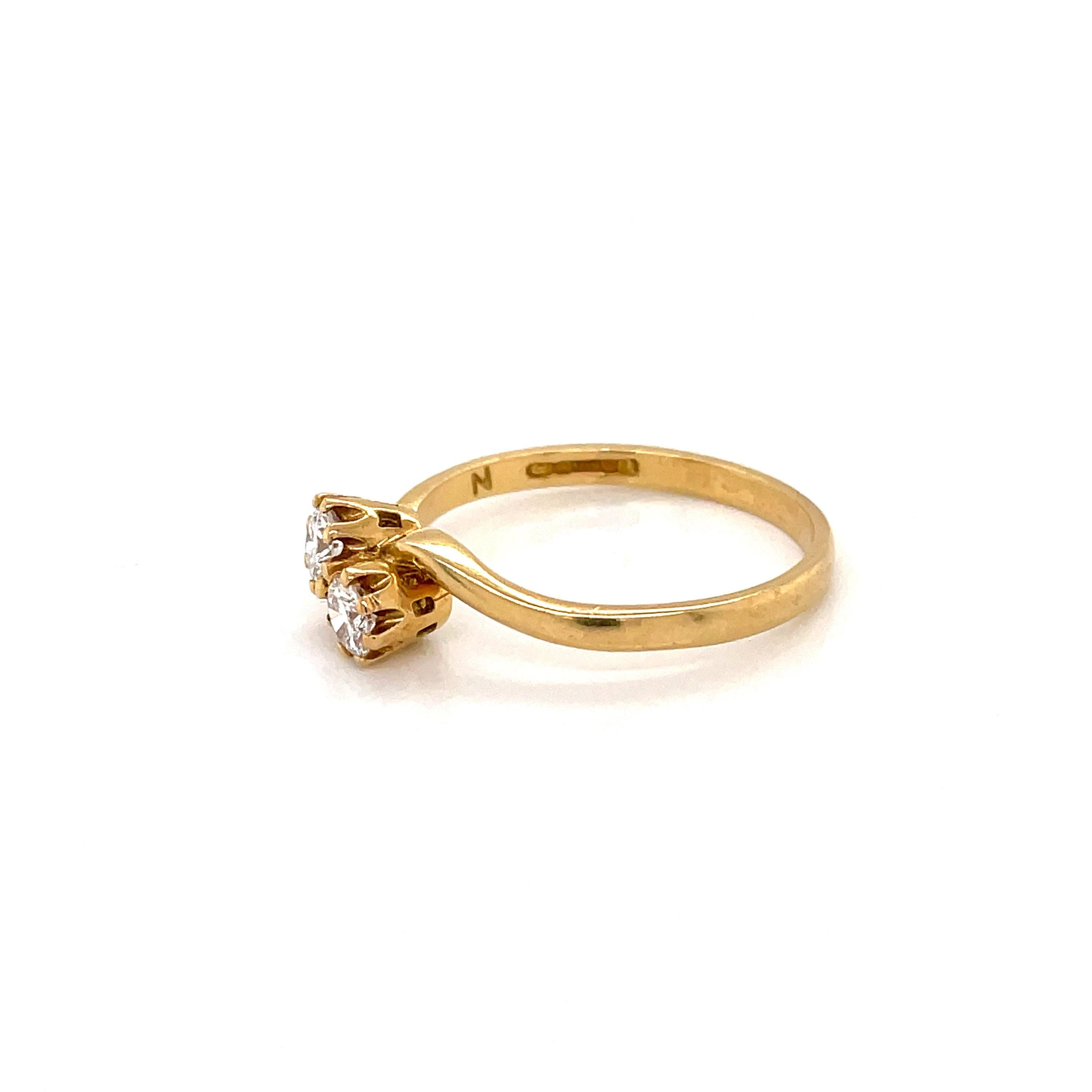 This gorgeous Toi Et Moi ring is set with two scintillating round brilliant cut diamonds totalling an estimated 0.30 carats, claw-set in an elegant 18ct yellow gold band. 

The ring is currently sized to a UK P, US 7 3/4 but could be altered. The
