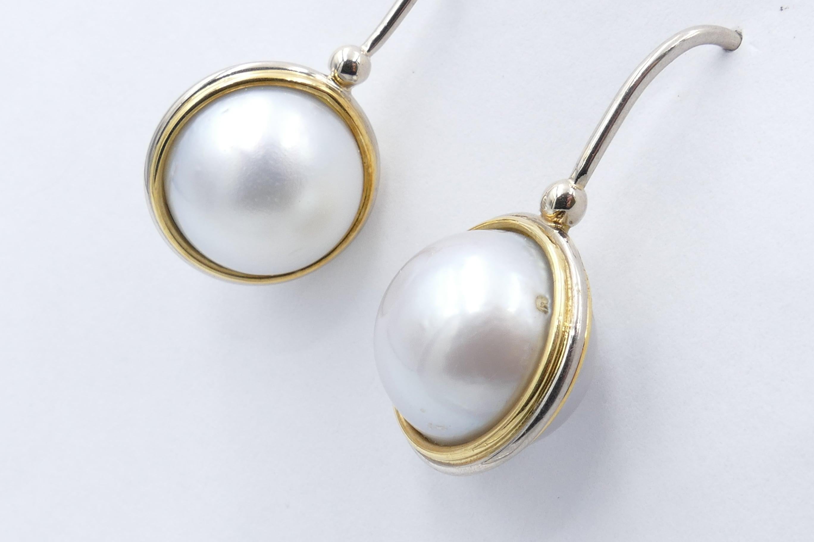 These are very unusual - and very effective.
There are 4 Mabe Pearls near round, pale grey with silvery purplish overtones and 14.45 diameter creating a double side effect in these very wearable earrings. the Pearls are set in 18ct Yellow Gold