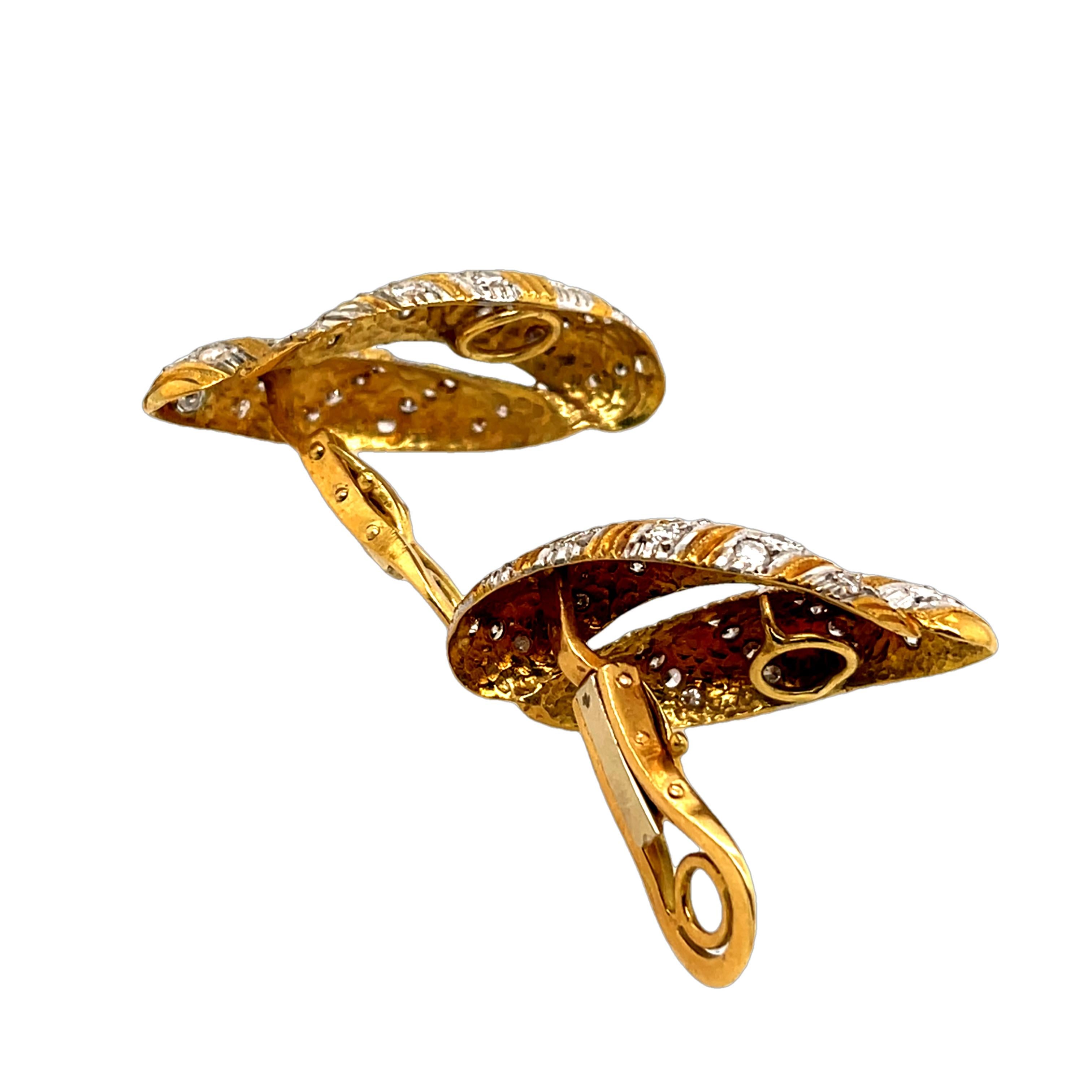 Exquisite 18ct yellow and white gold diamond earrings, elegantly designed and set with a total of 2.40ct natural diamonds. Featuring a stunning combination of yellow and white gold these earrings offer timeless sophistication and brilliance.