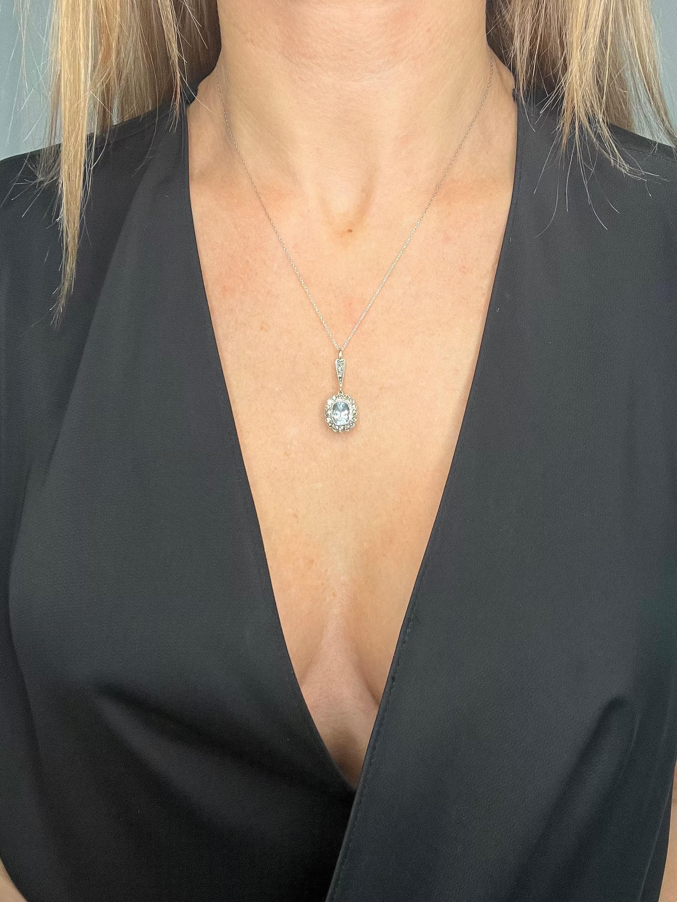 Antique Aquamarine Pendant 

18ct Gold Tested

Circa 1930s

This exquisite pendant necklace is crafted from 18ct gold and features a stunning oval-shaped faceted aquamarine set in white gold. The aquamarine is surrounded by a beautiful halo of