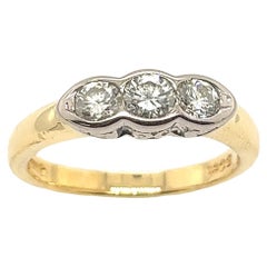 Anillo de oro amarillo y blanco de 18 ct con 3 diamantes y 0,38 ct de diamantes