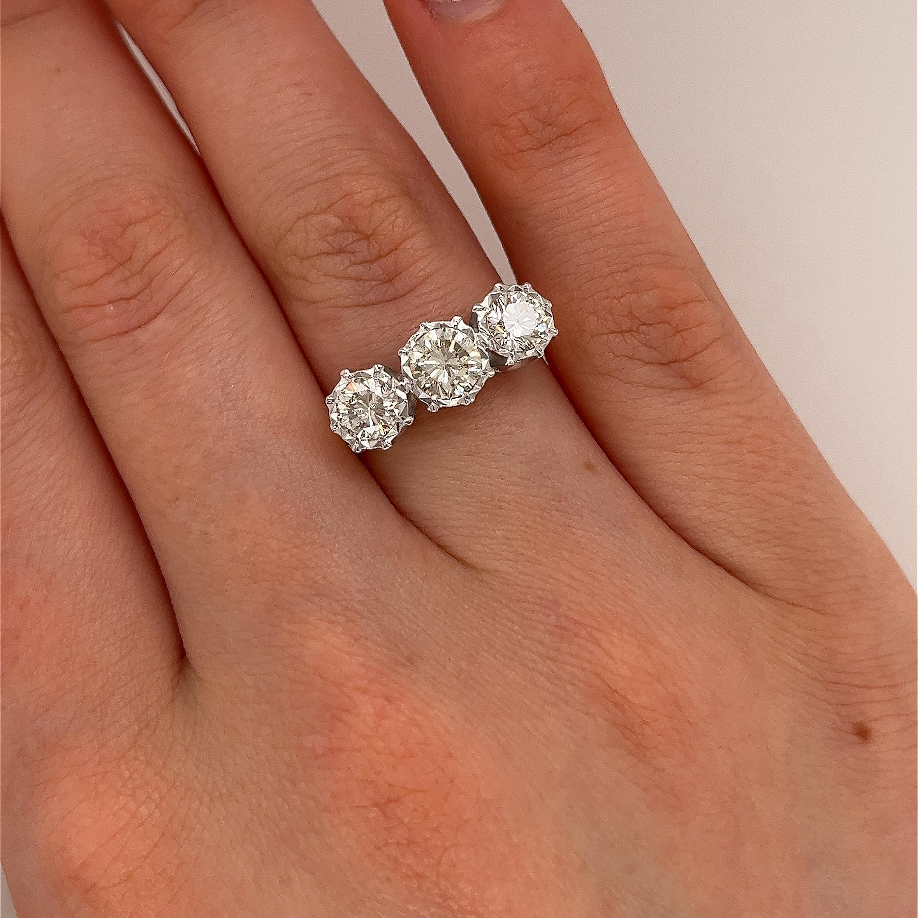 An 18ct Yellow & White Gold 3 Stone Diamond Ring, 
set with 1.46ct natural diamonds, is a stunning and versatile piece.
With a total carat weight of 1.46ct, this ring features diamonds 
that are substantial in size and presence, ensuring a